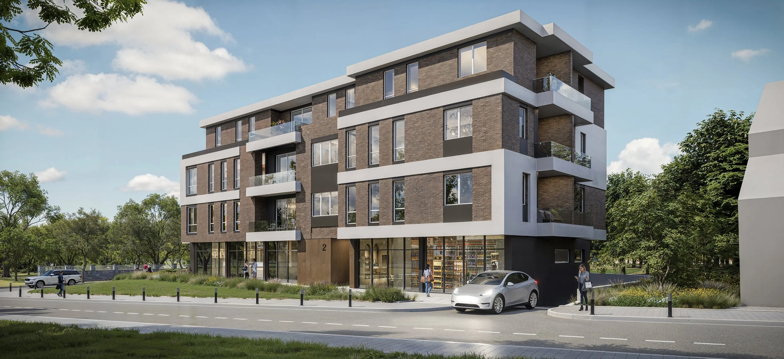 Modern four-story residential building with brick and white exterior, large ground-floor windows, and balconies, set in a green area with trees and a sidewalk, with cars and pedestrians nearby.