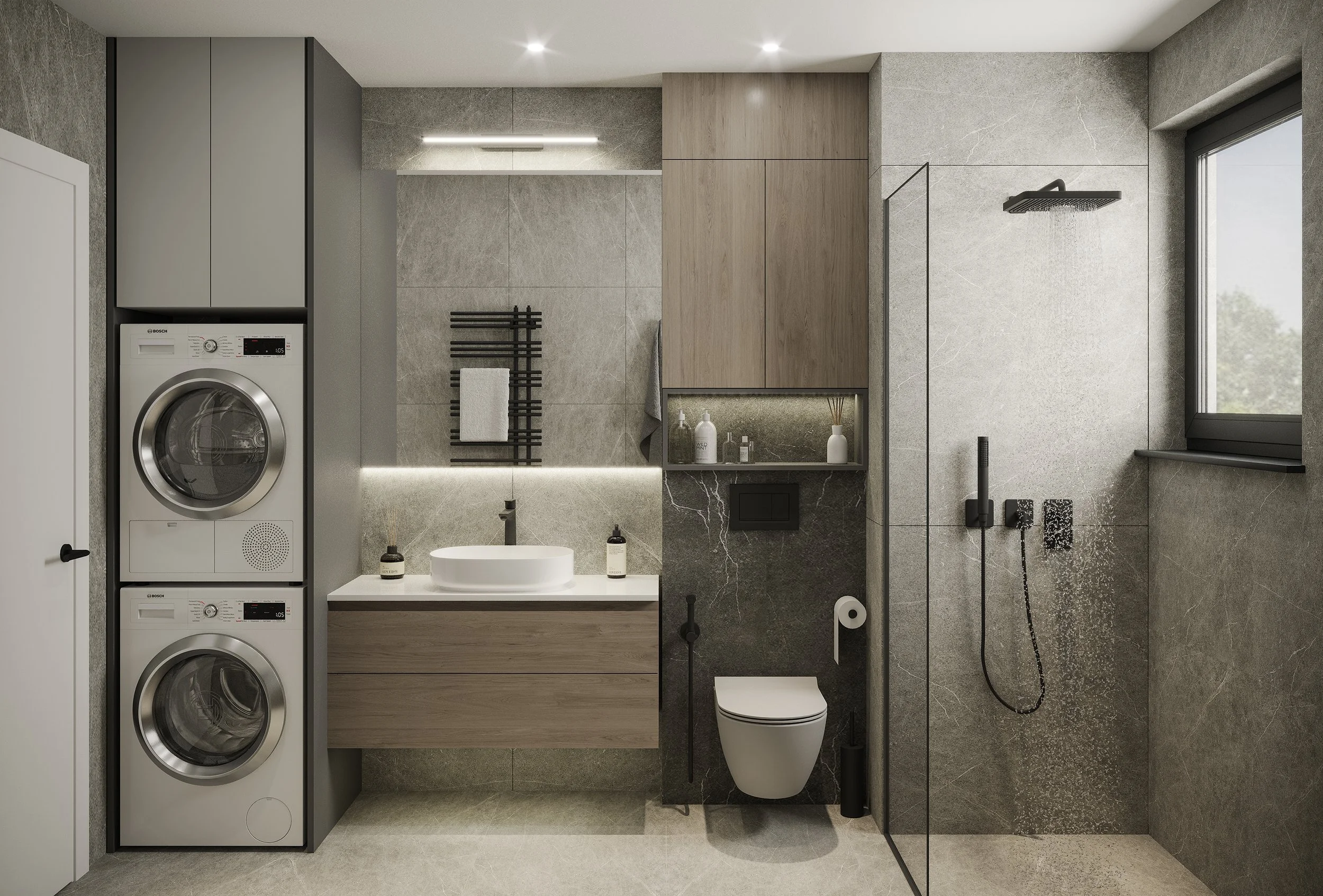Modern bathroom with a stacked washer and dryer, a round white sink on a wooden vanity, a wall-mounted toilet, a shower with a black rain showerhead, and a window, with gray tiled walls and fixtures.