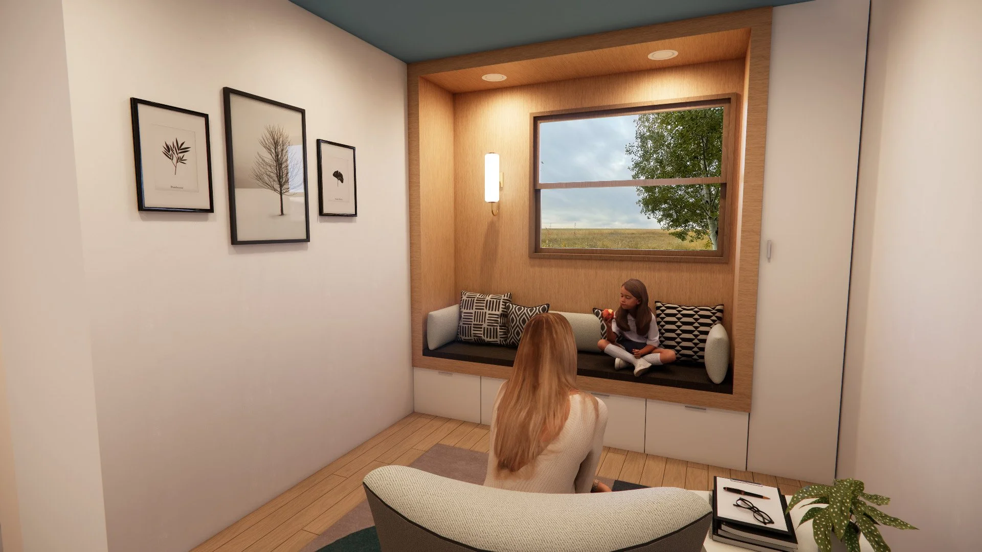 Living room with a built-in window seat, two girls sitting on it, one facing away and the other holding a toy, artwork on the wall, and a window showing trees outside.