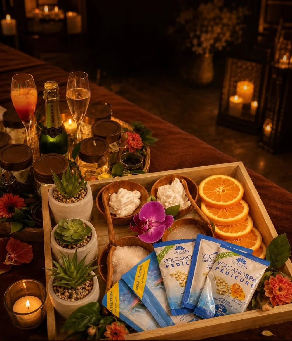 Foot spa and head spa set-up with fresh orange, orchids and tea for the Aurora Ultimate Ritual