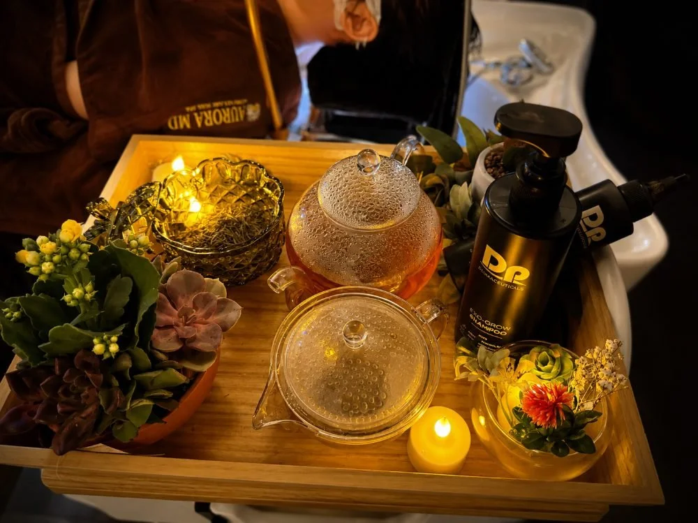 Tray of EXO-Grow products, teas and candles for the Peptide Density Ritual