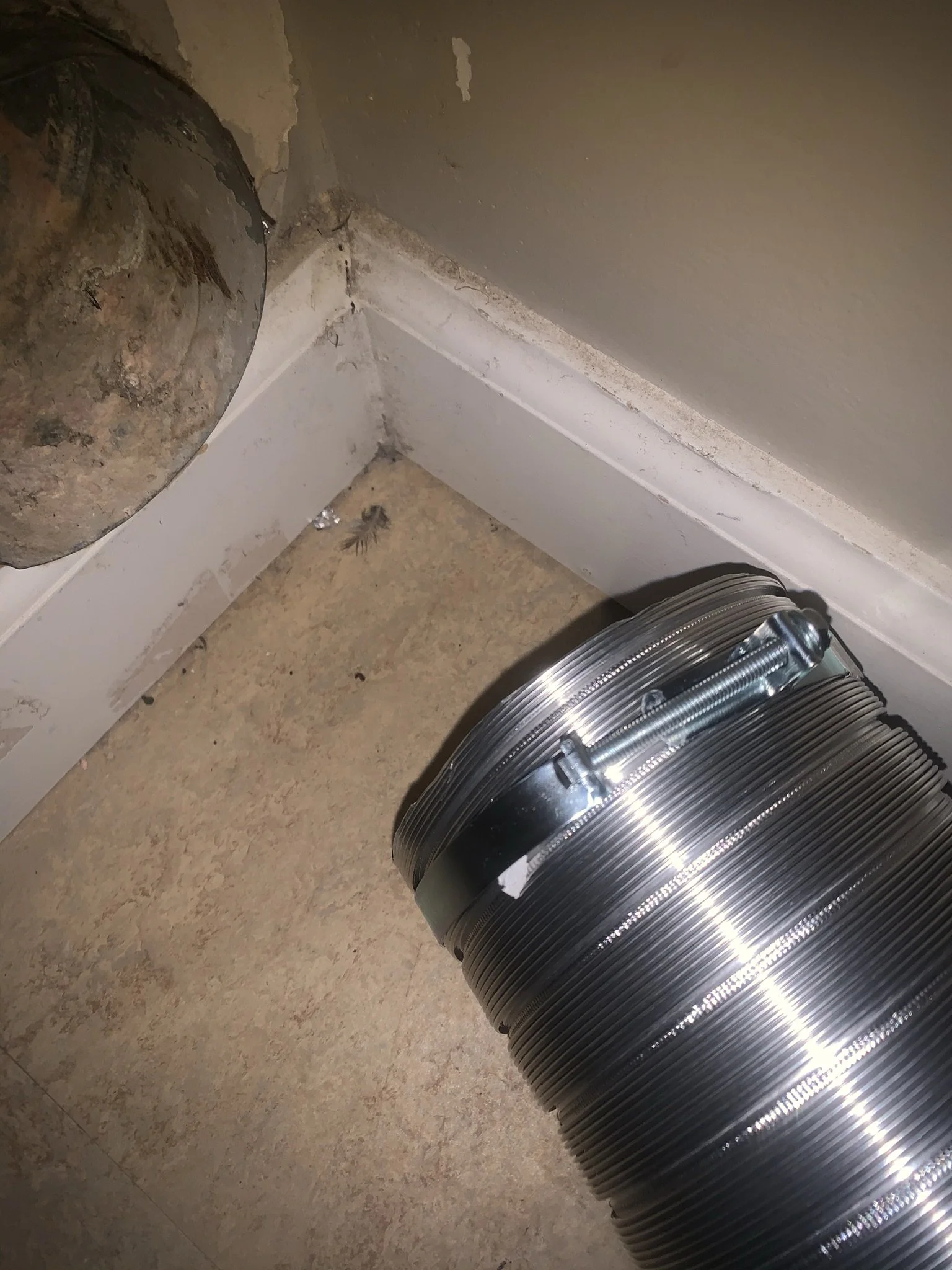 Close-up of a flexible dryer vent connector extender.
