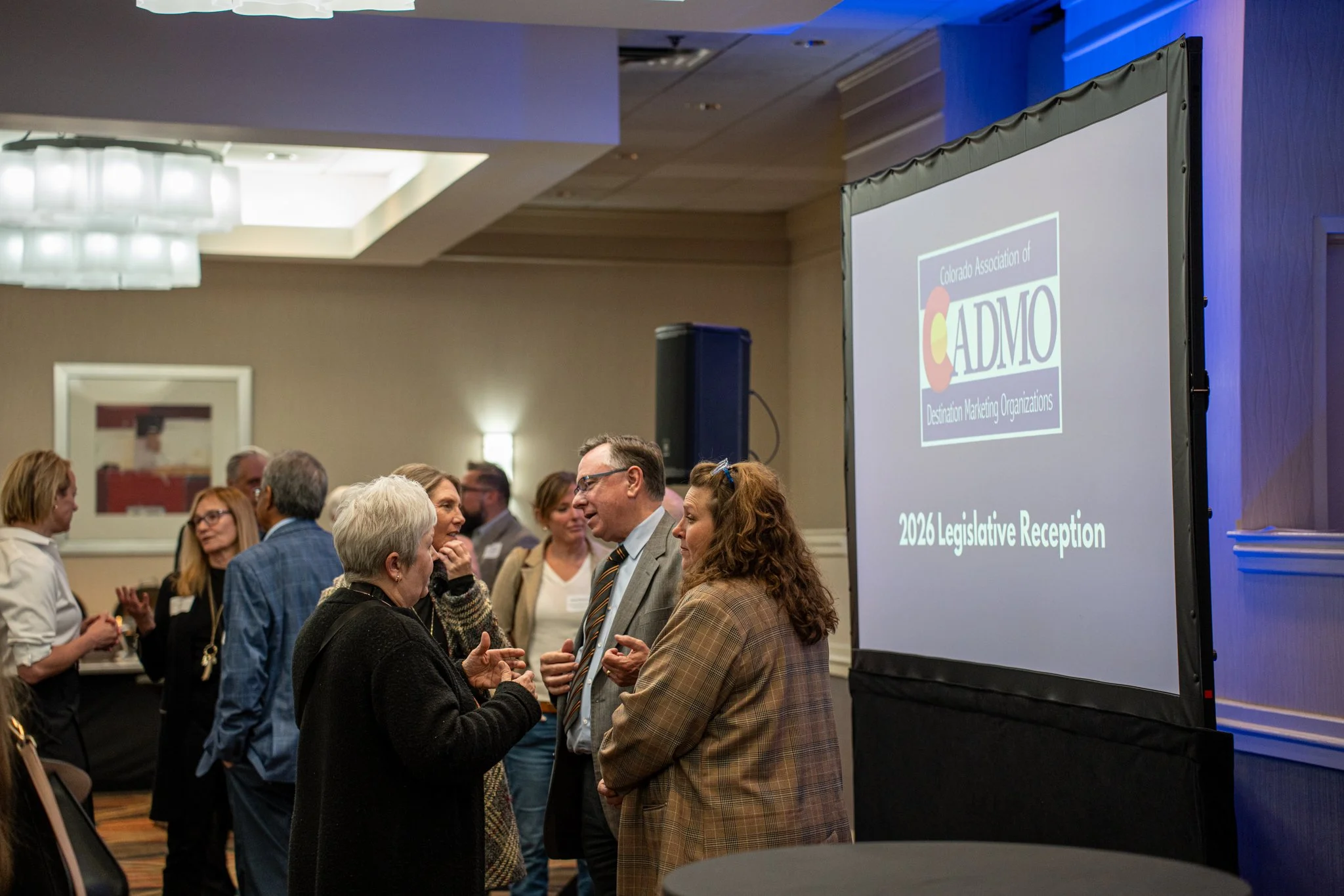 People in a conference center talking