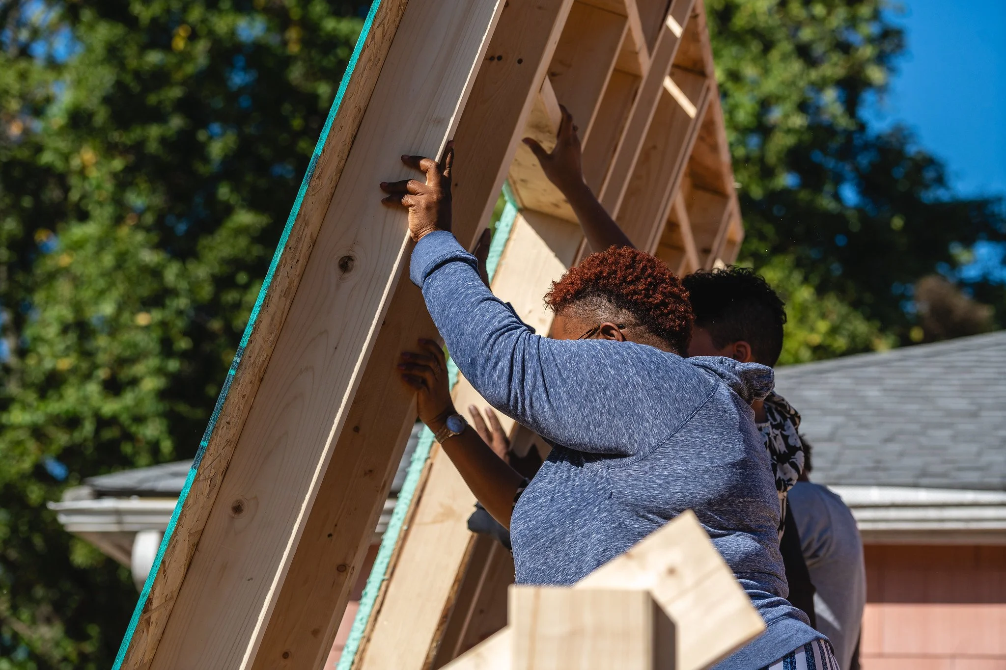Image of people building homes.