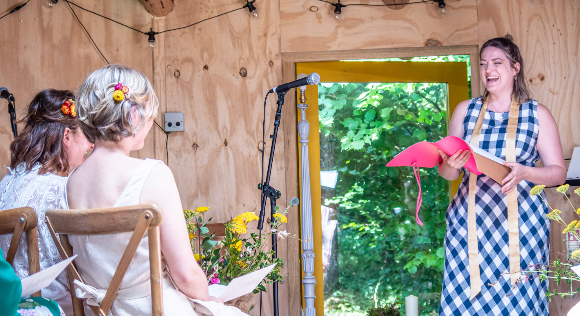 Interfaith celebrant Rev Holly and brides at LGBTQ wedding ceremony