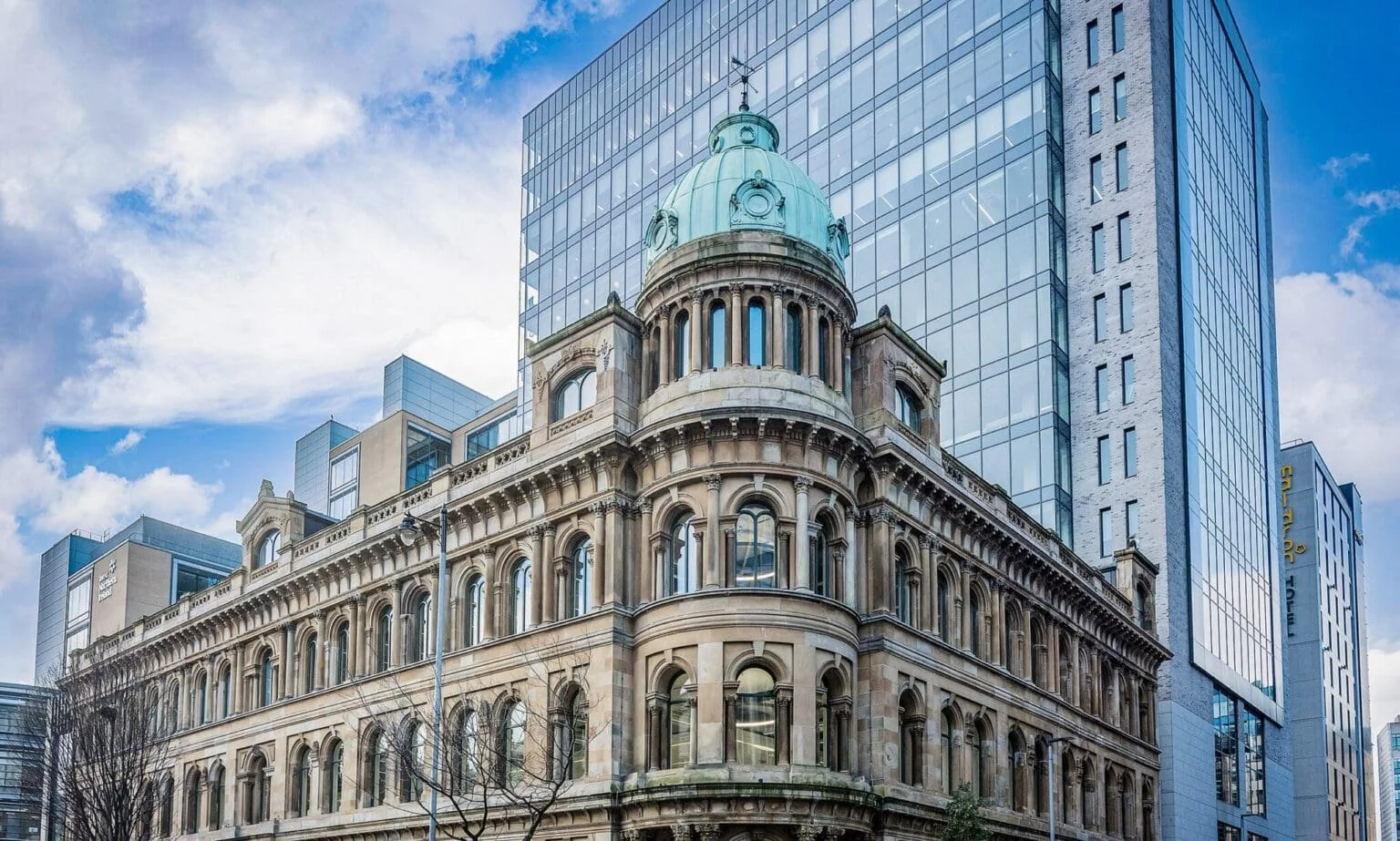 Irvine Questions Long-Term Economic Strategy Following Deloitte Expansion in Belfast