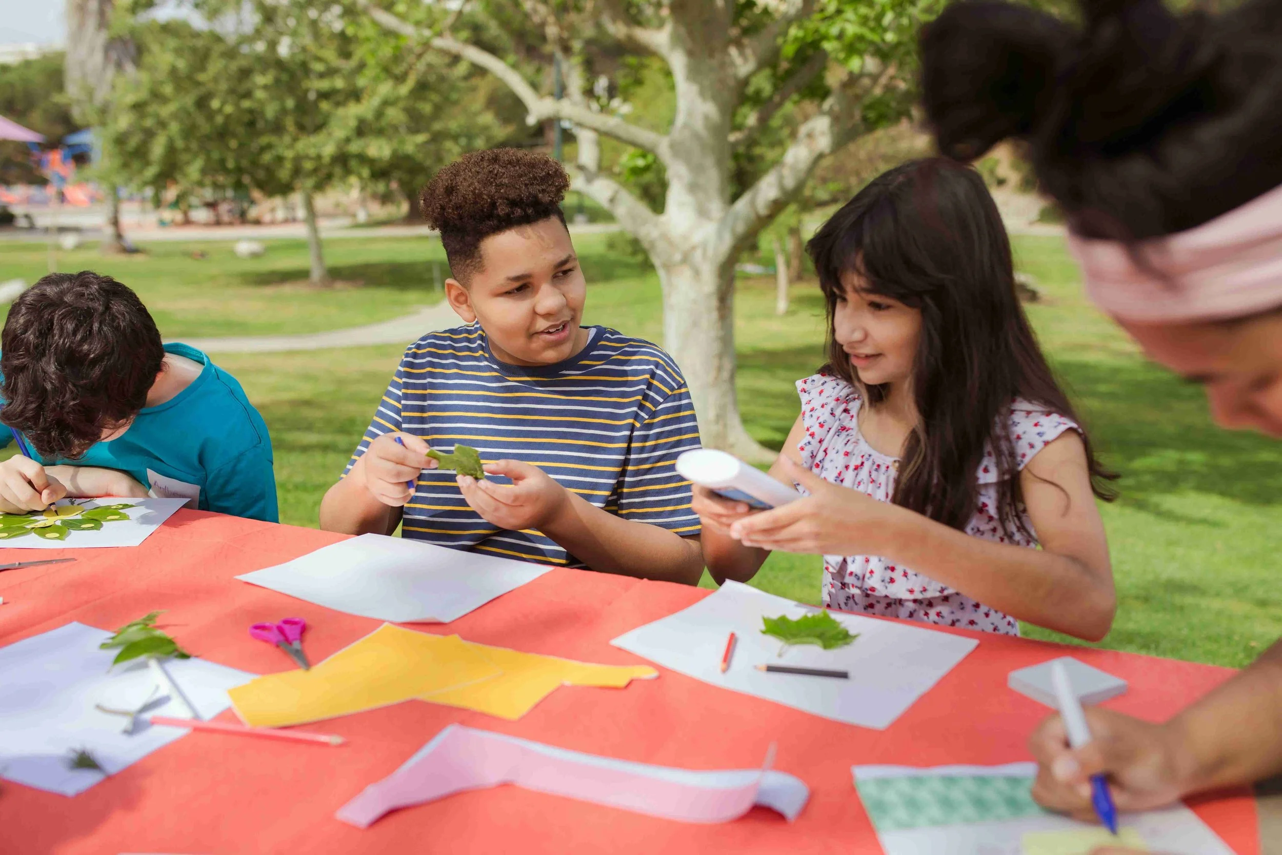 Yellow Wood Academy students doing hands-on outdoor learning activity with nature materials