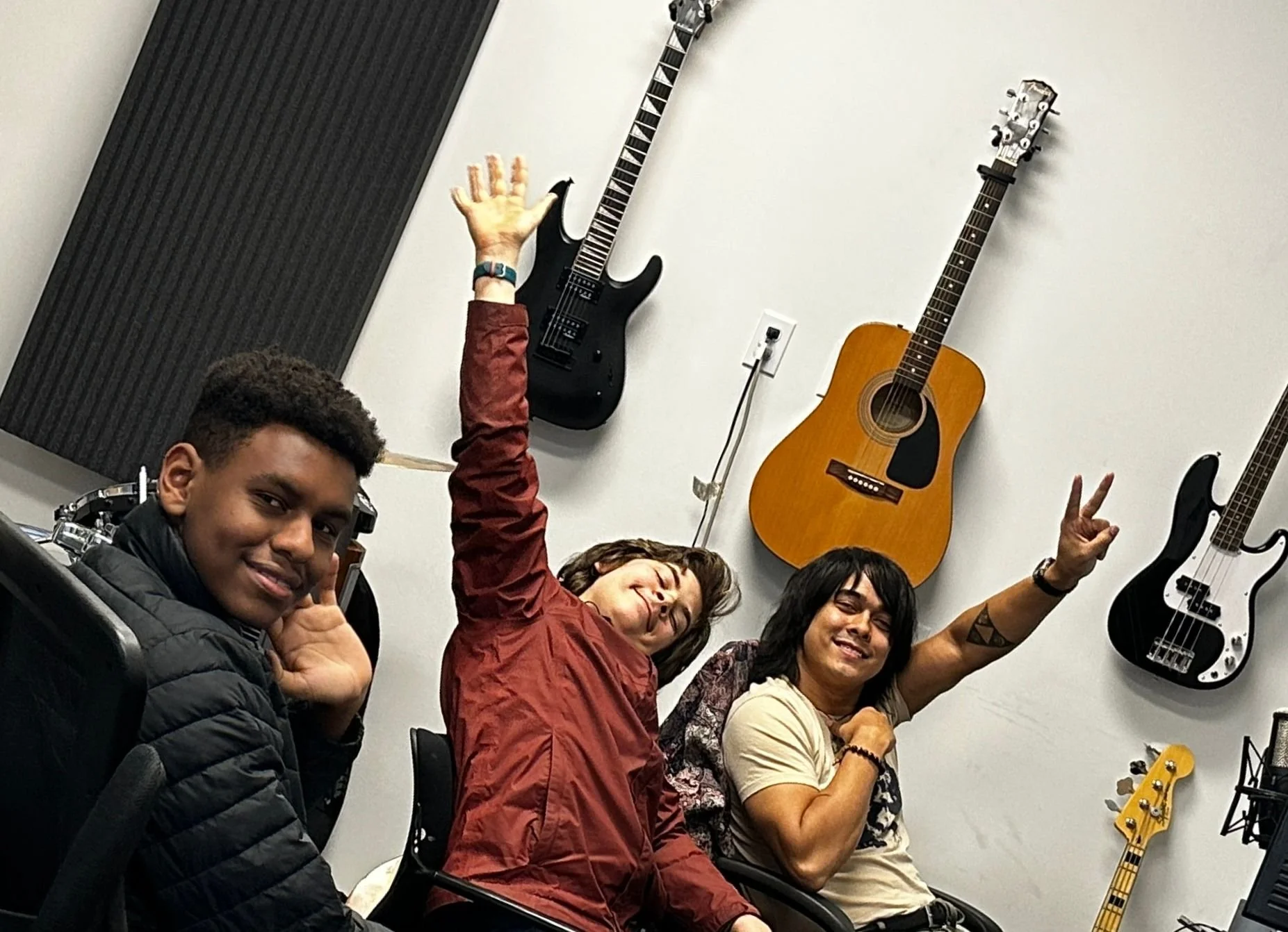 Yellow Wood Academy students in the recording studio with guitars and music equipment
