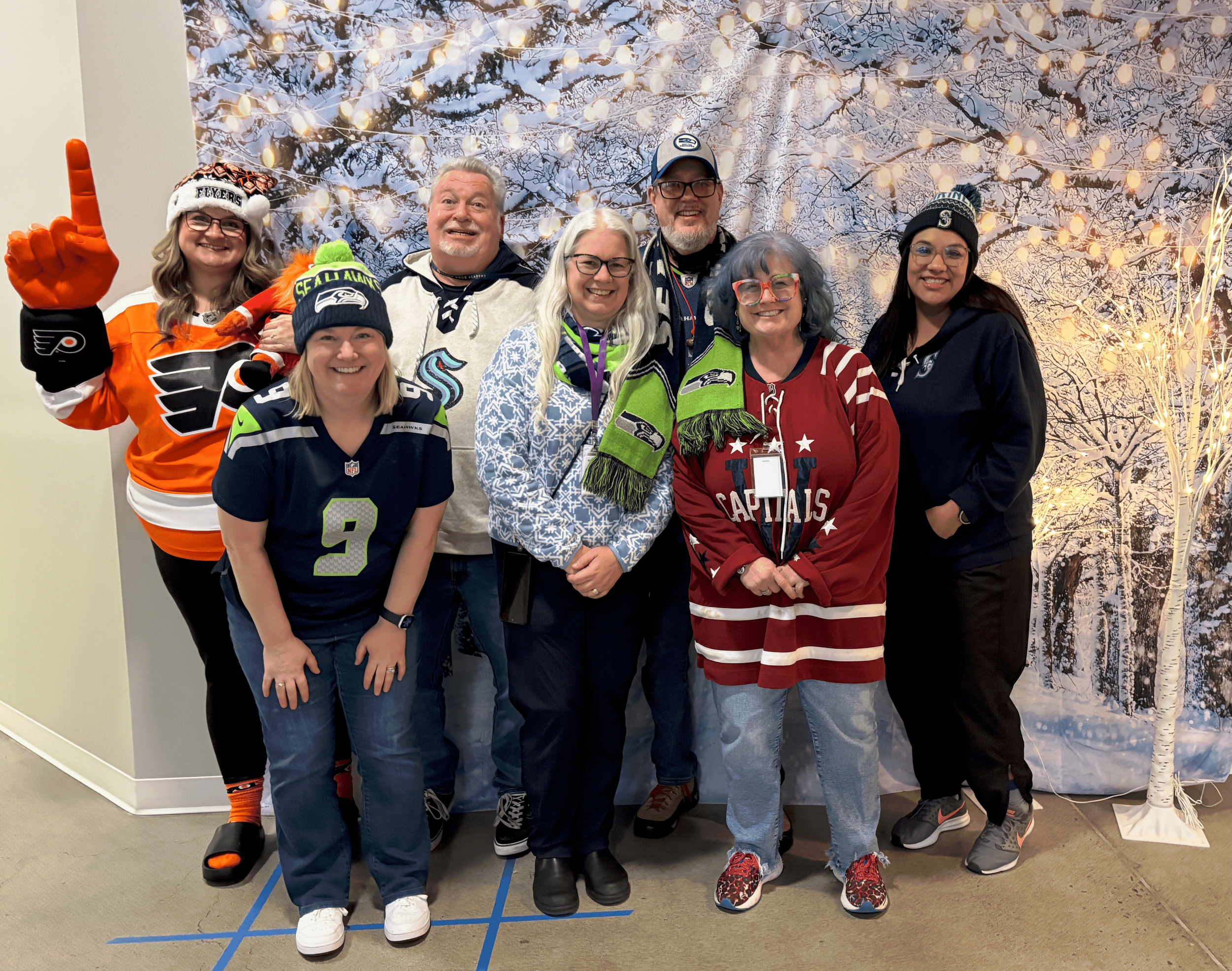 Yellow Wood Academy staff celebrating Winter Spirit Week in festive sports team outfits