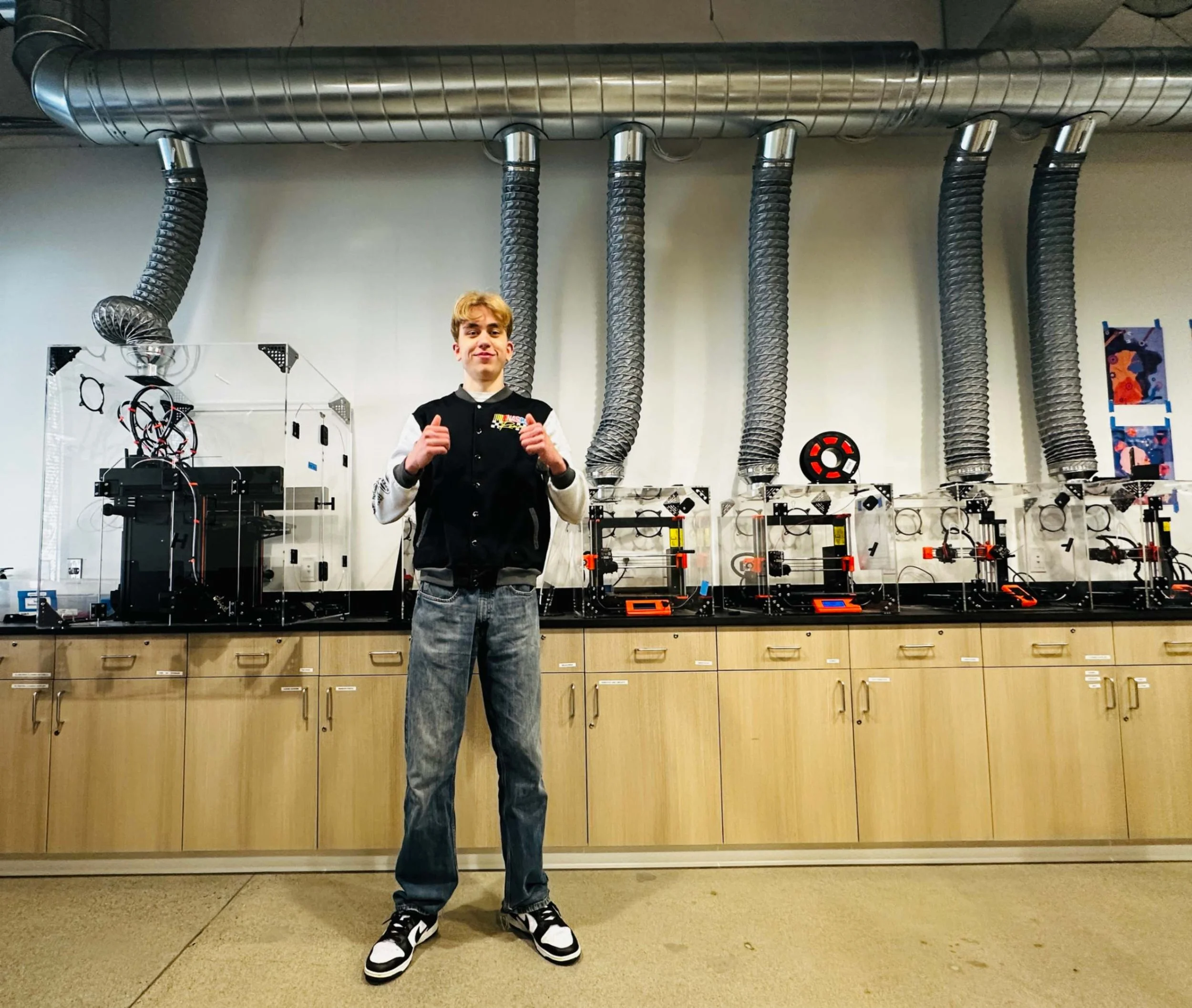 Yellow Wood Academy student in the makerspace with 3D printers for hands-on learning