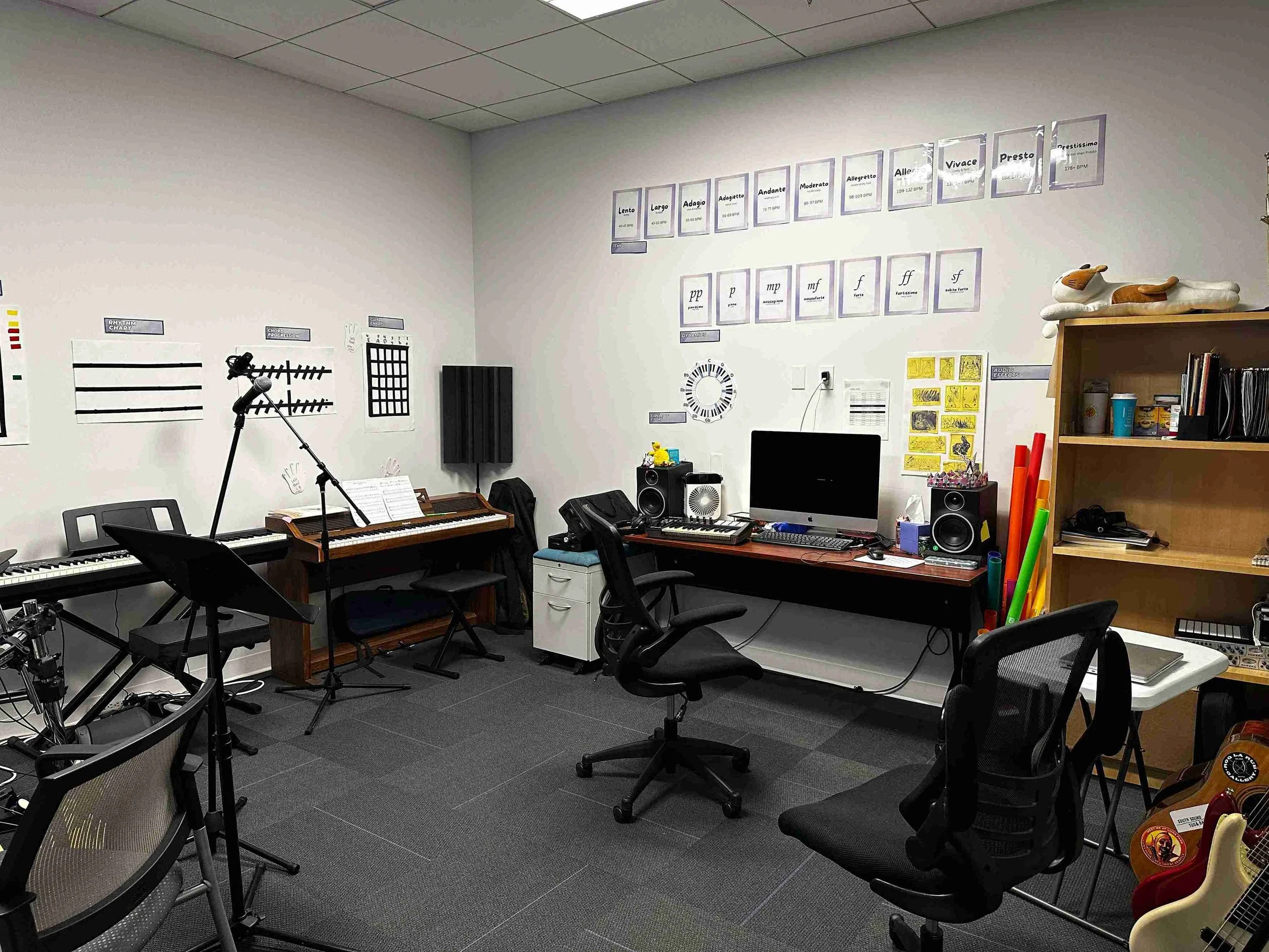 Yellow Wood Academy music studio with piano, recording equipment, and student learning space