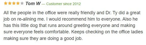 Screenshot of an online review about Dr. Ty, mentioning a friendly office environment, a small dog greeting everyone, and the staff making patients feel comfortable.