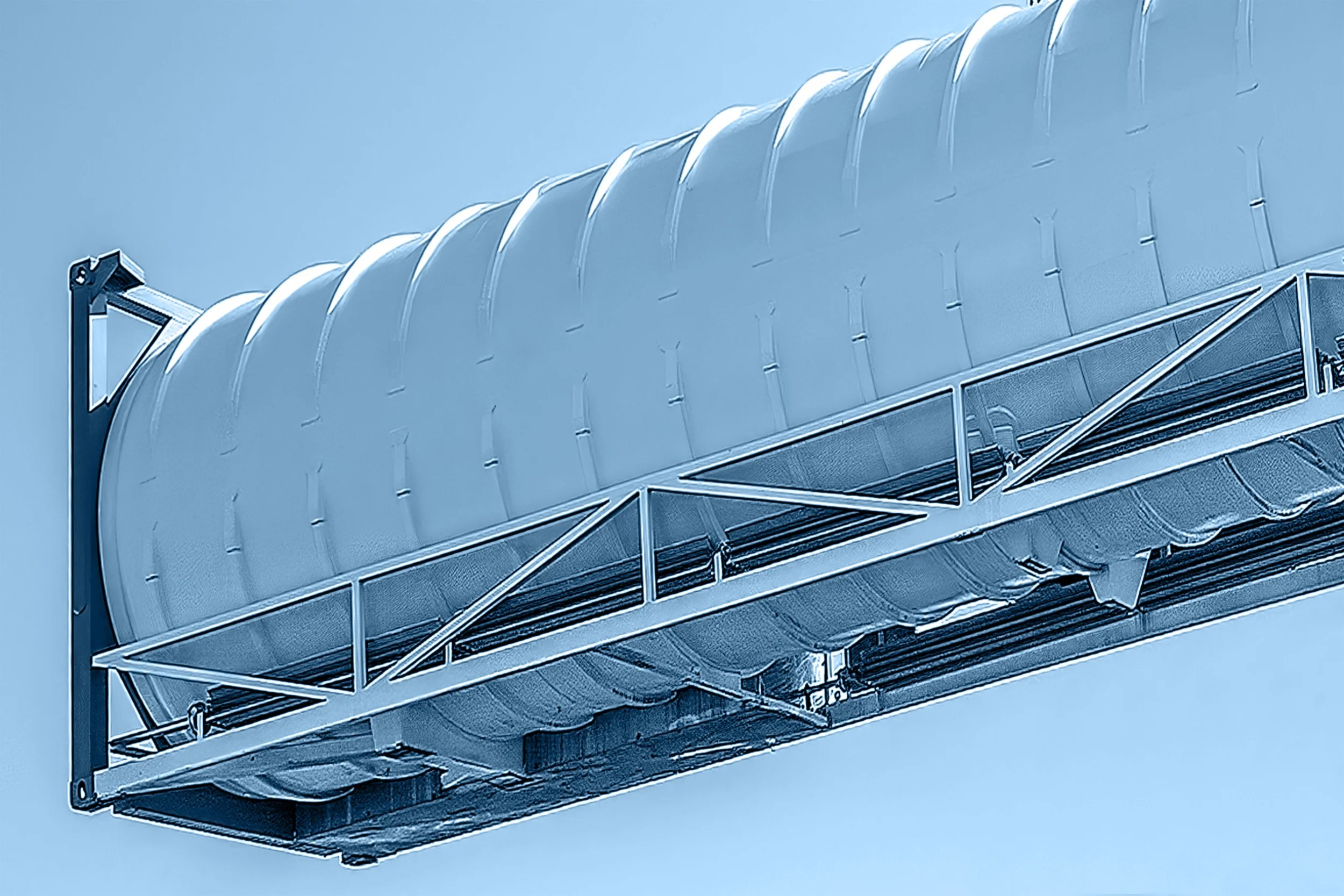 A large, modern wind tunnel with a metallic, semi-circular intake and supporting structure, set against a clear blue sky.