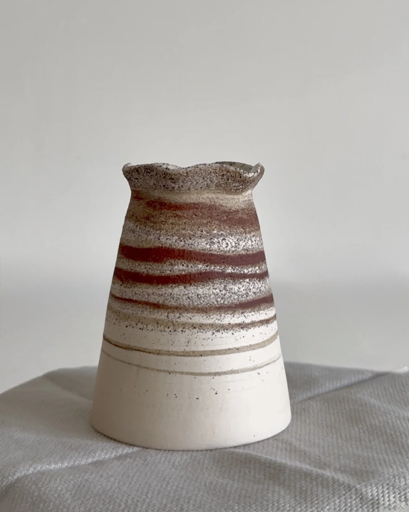 frilly edge mixed clay layered and speckled vase