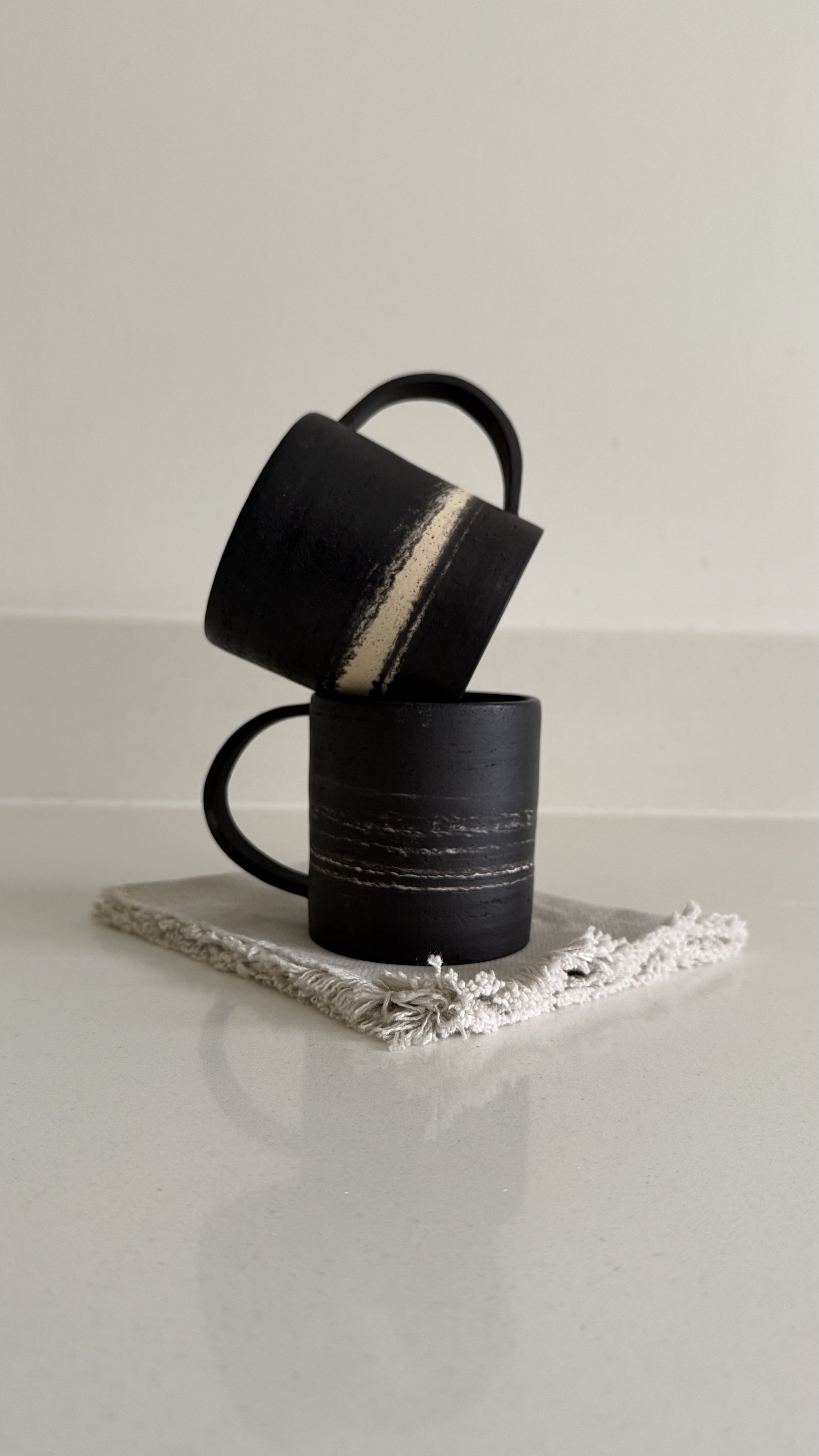 black mixed clay mug