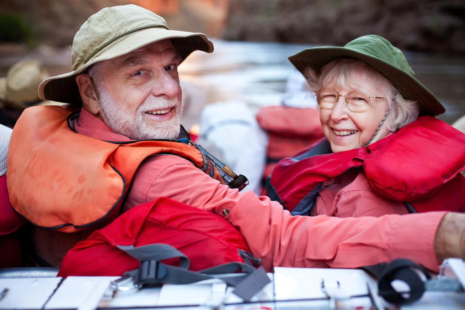 Older couple rafting on a river