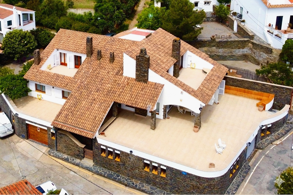 Drone view of the exclusive rental house in Cadaqués, front-line to the sea on Llané beach.