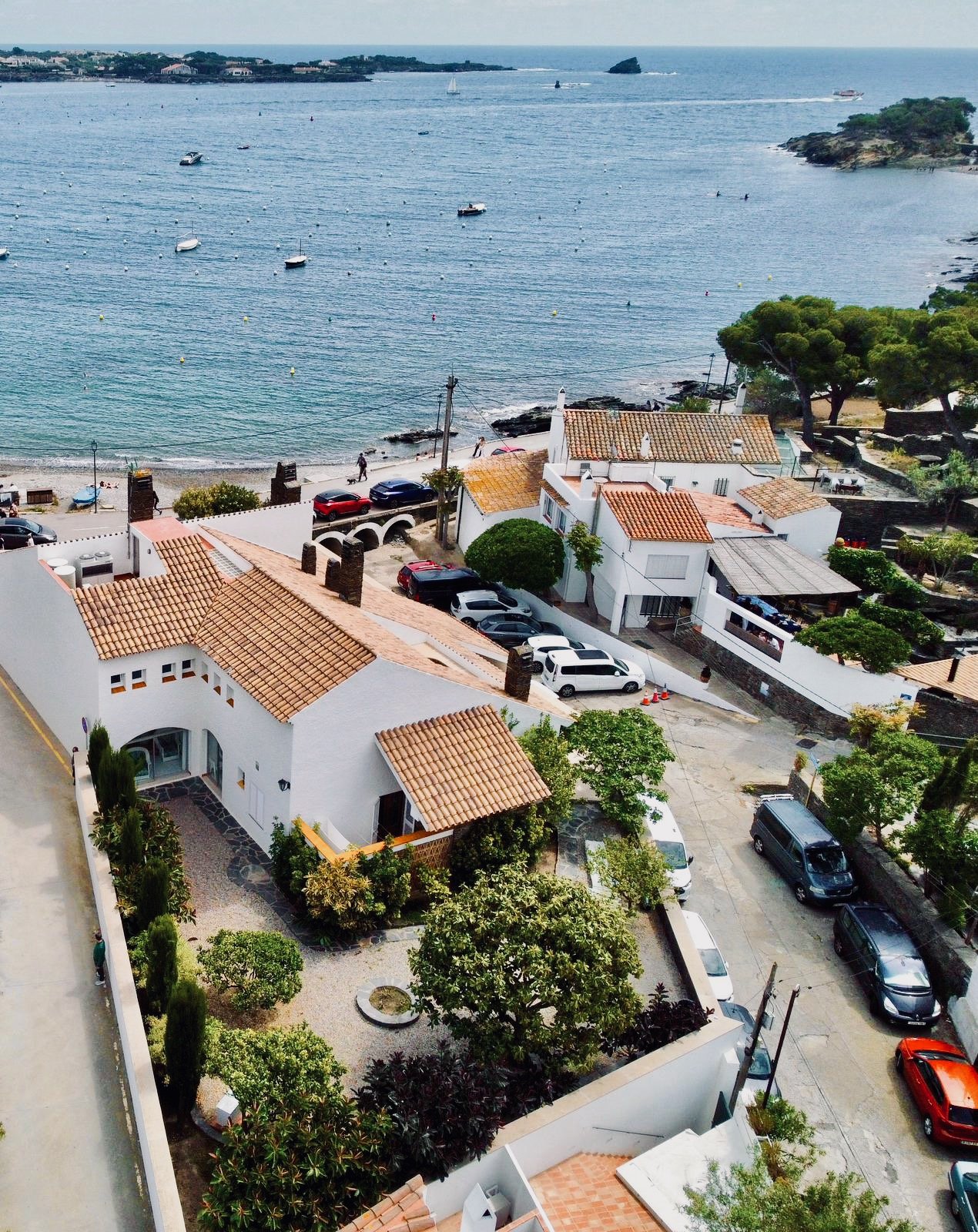 Drone view of the exclusive rental house in Cadaqués, front-line to the sea on Llané beach.