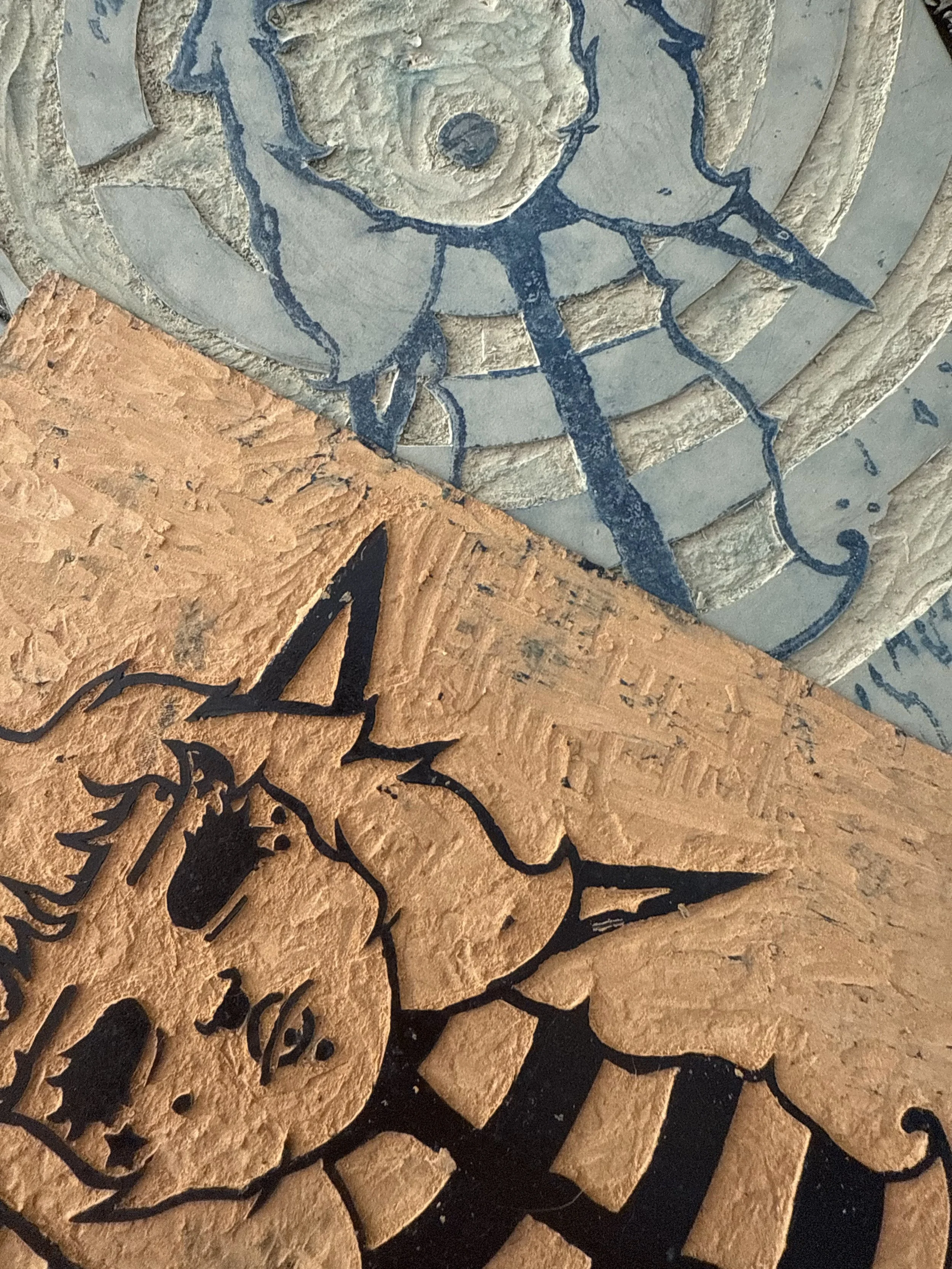 Both linoleum cut blocks used for "Star face", 2025.