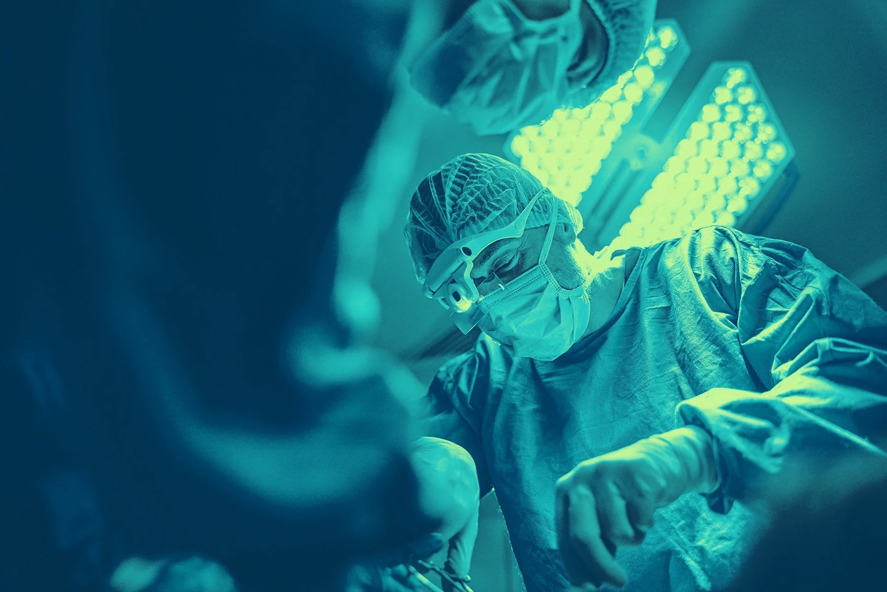 Surgical team treating severe peripheral artery disease complications including ulcers and limb-threatening ischemia