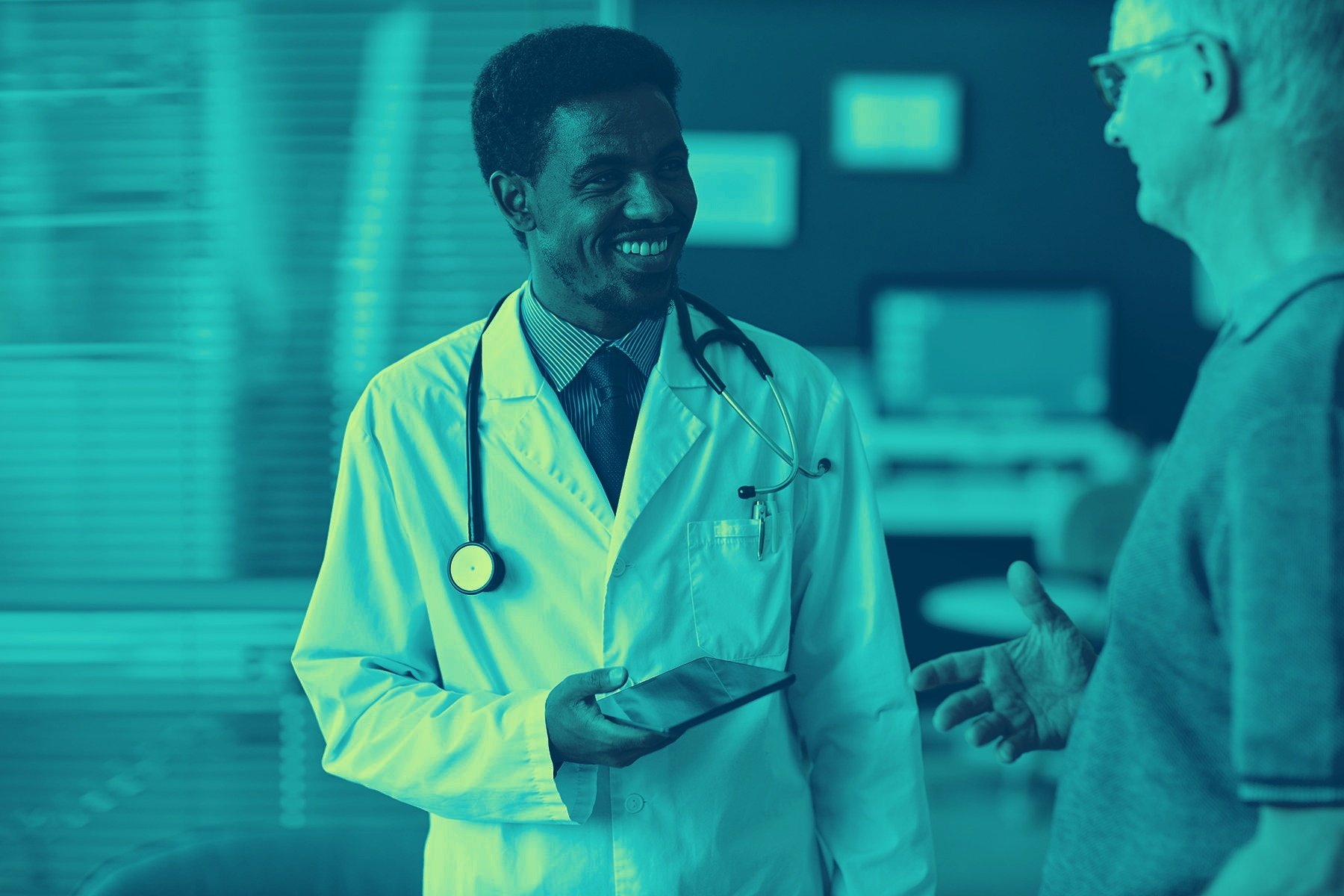Vascular specialist consulting with peripheral artery disease patient using digital health tools