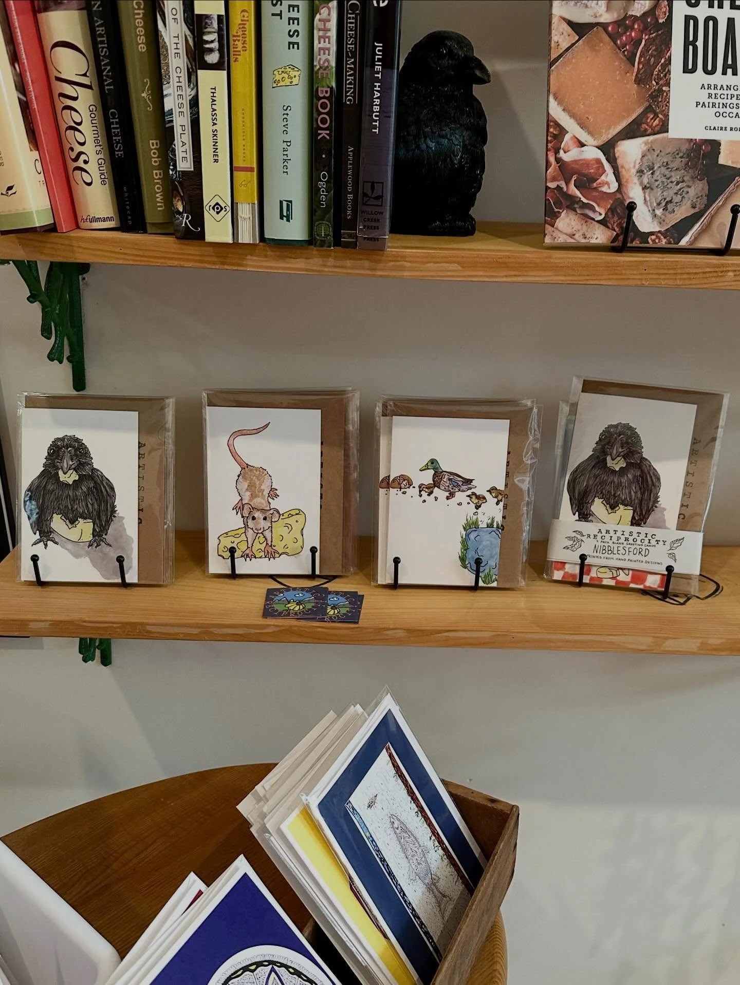 Be sure to pay a visit to @nibblesford in Biddeford ME to shop exclusive themed greeting cards. And while you&rsquo;re there grab yourself a tasty treat and some community forward vibes. 🐦&zwj;⬛🧀 #shoplocal #indigenousart #handdesignedcards #locala