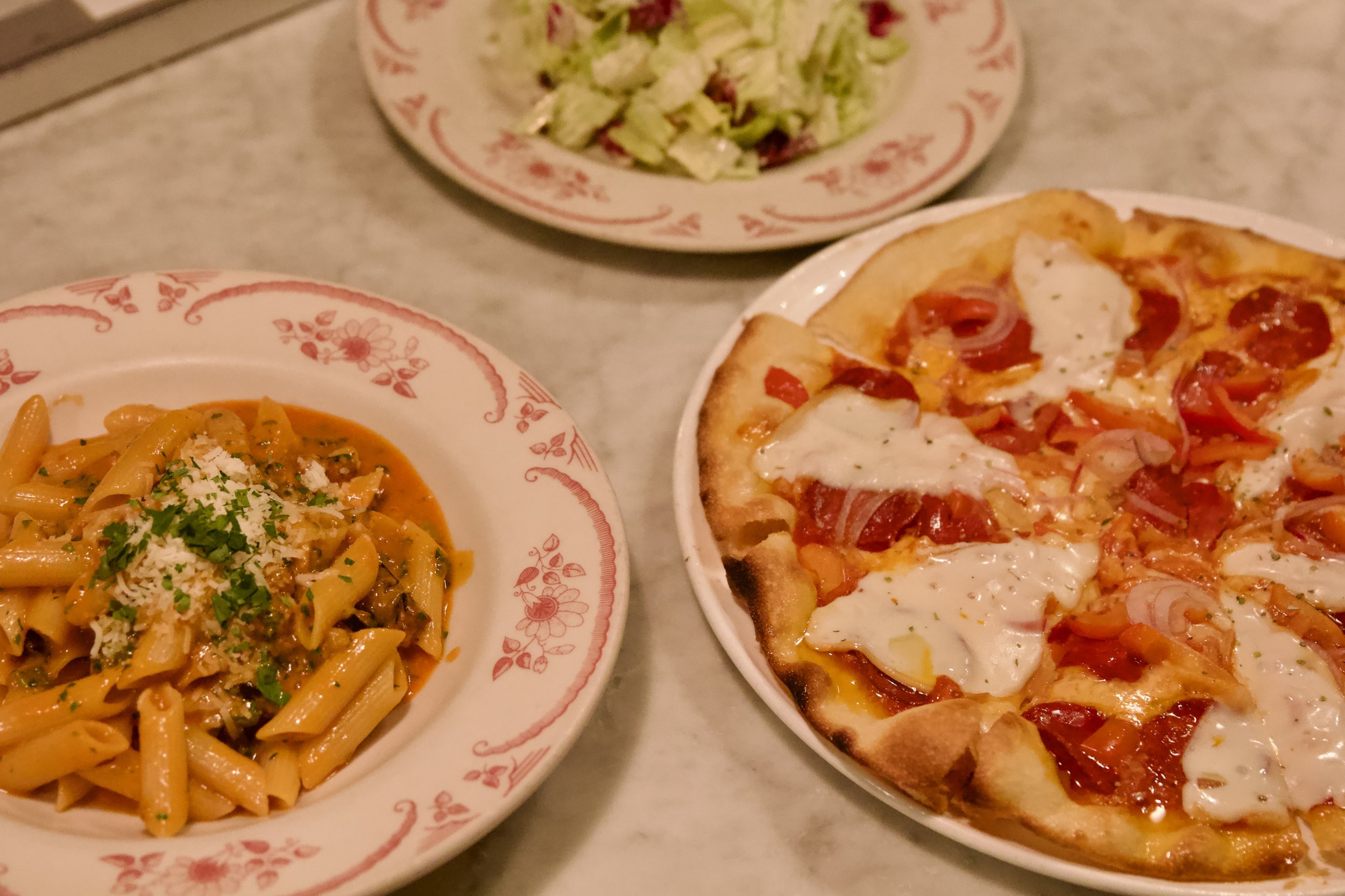 A variety of dinner offerings including pasta, pizza and salad