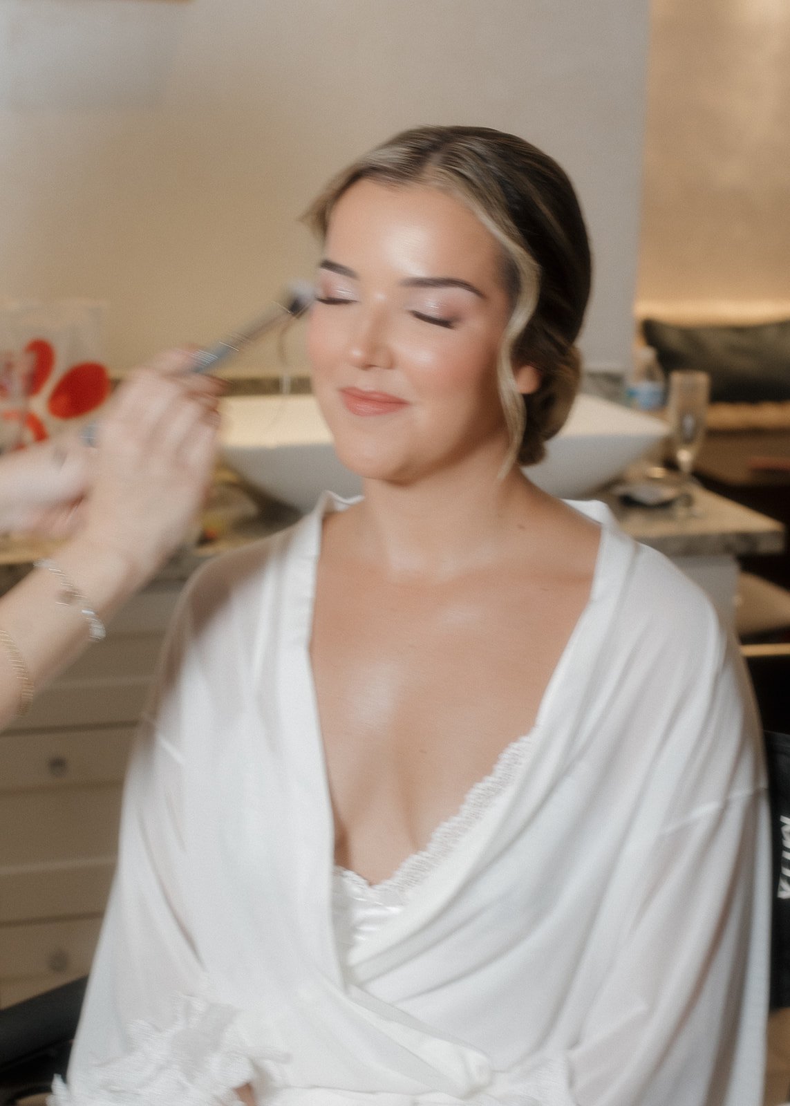 Stylized getting ready photo of bride.