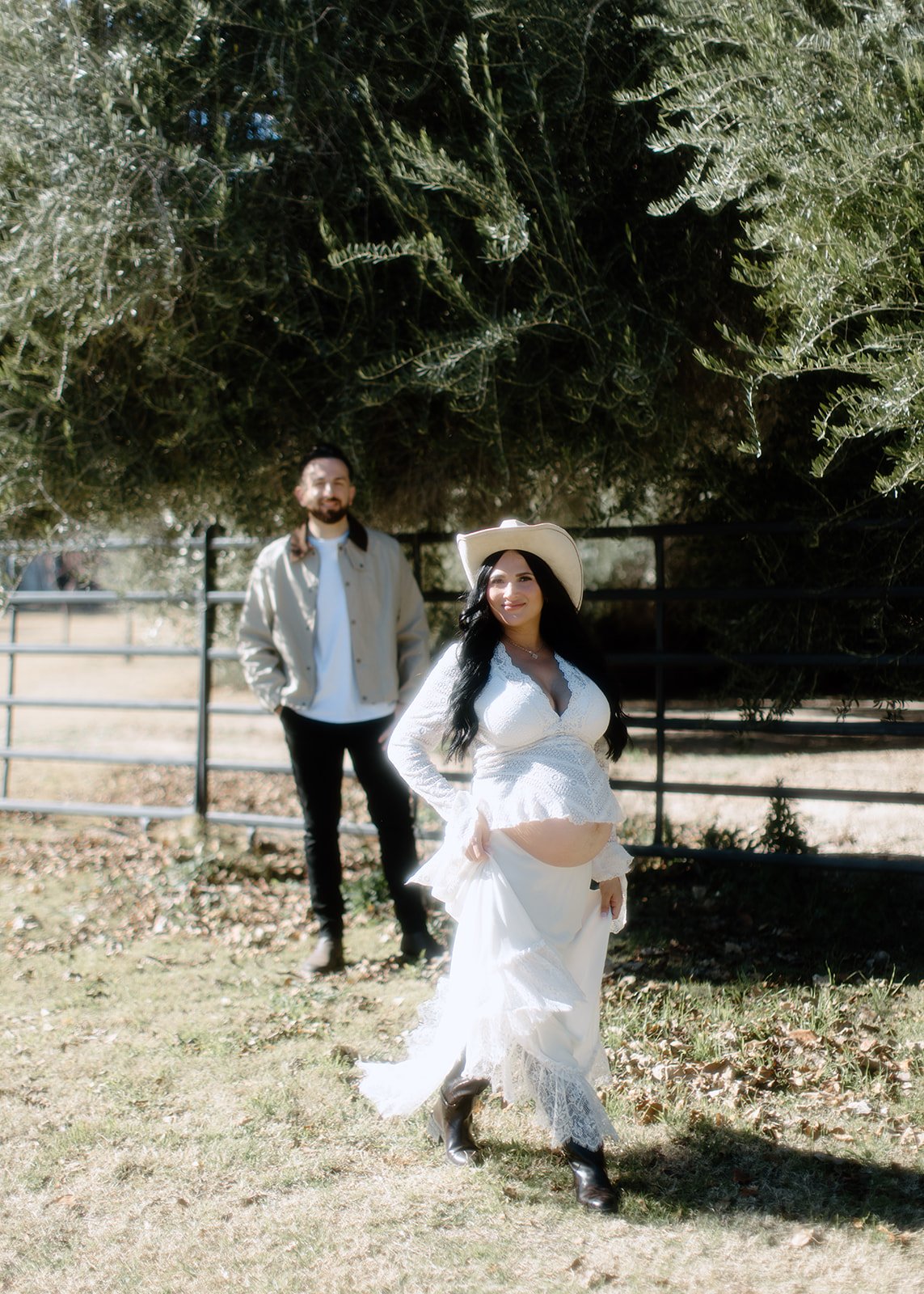 Expectant couple posed together during maternity portrait.