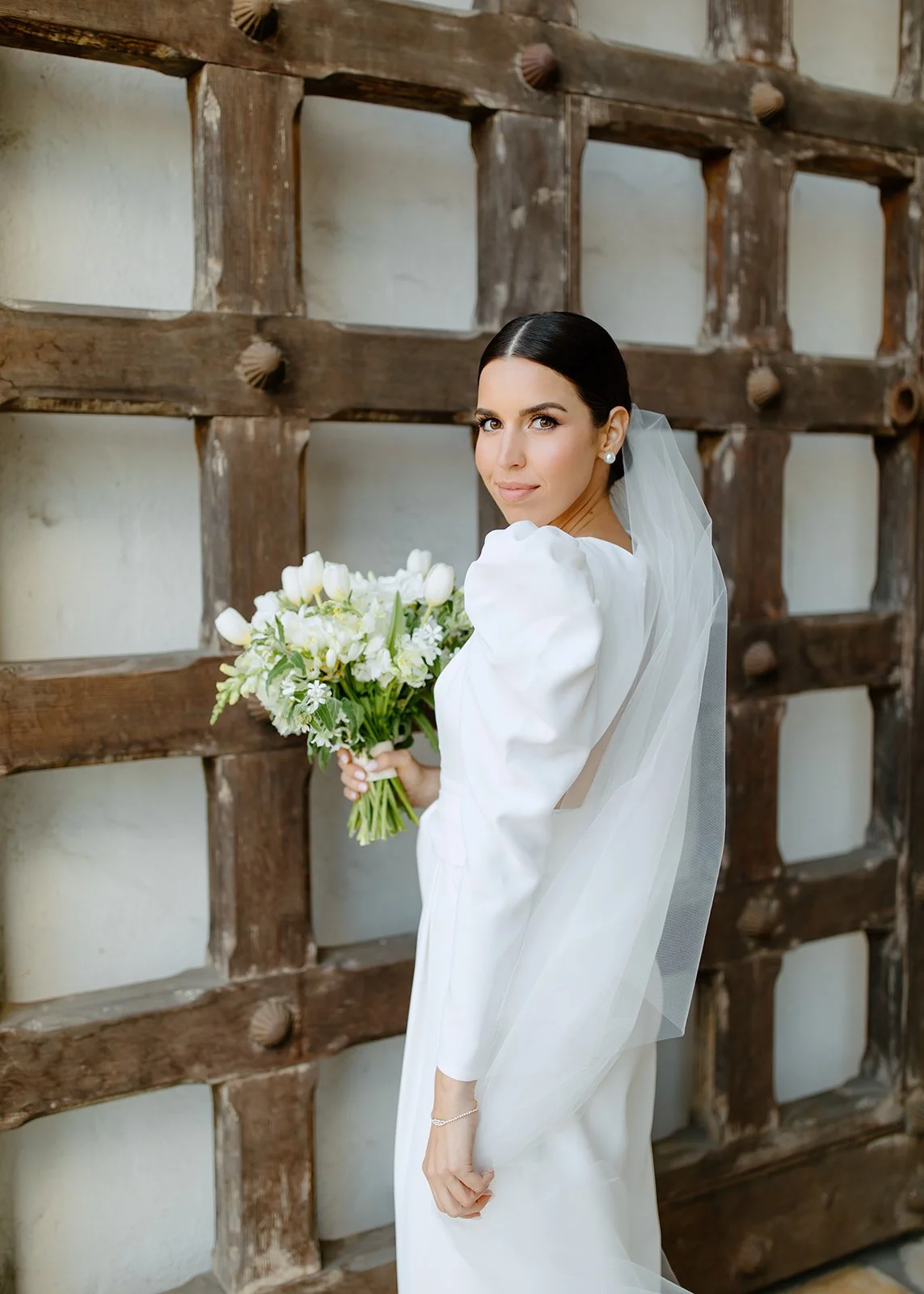 Sleek, editorial bridal portrait with minimal styling.