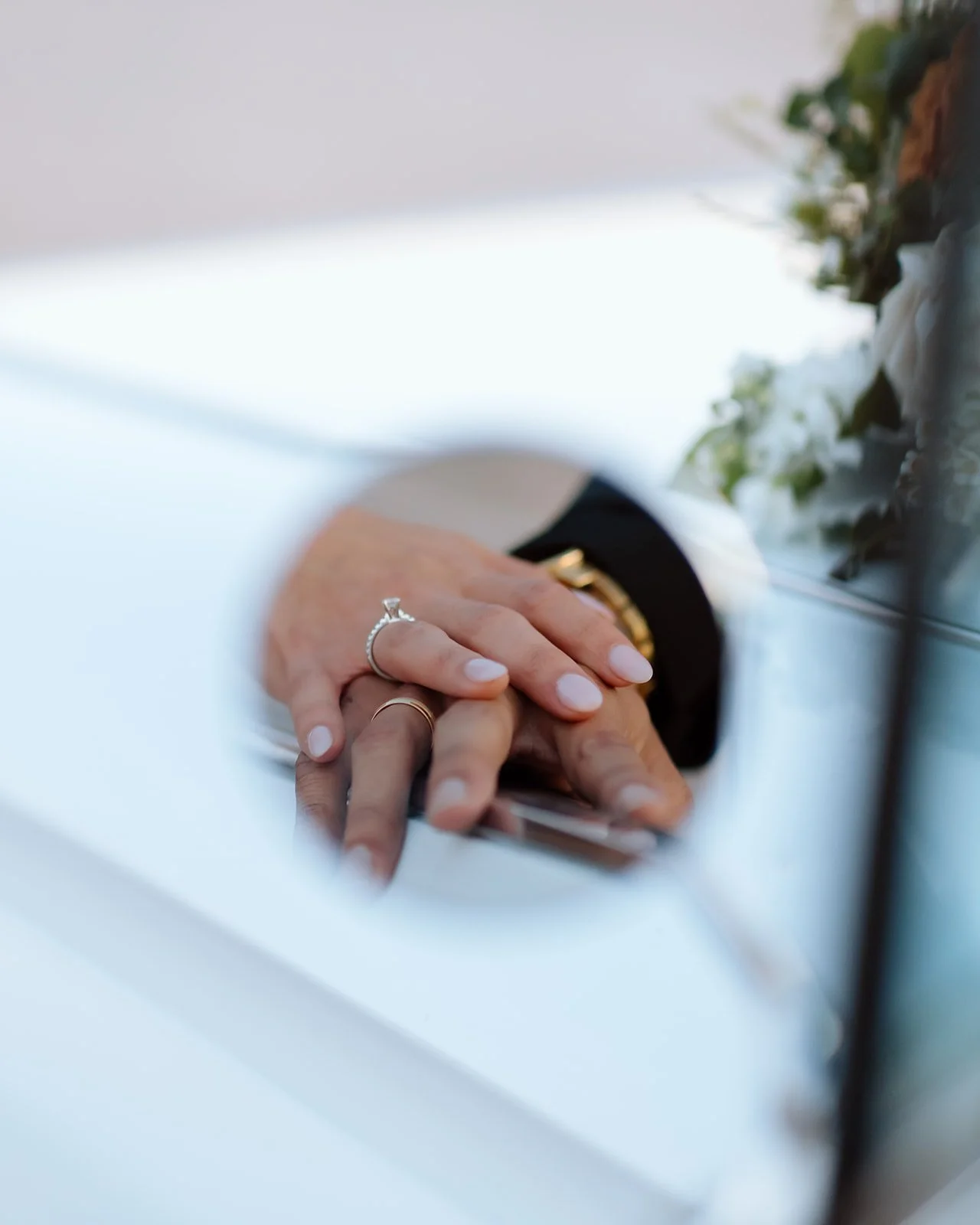 Close-up of engagement ring detail in natural light.