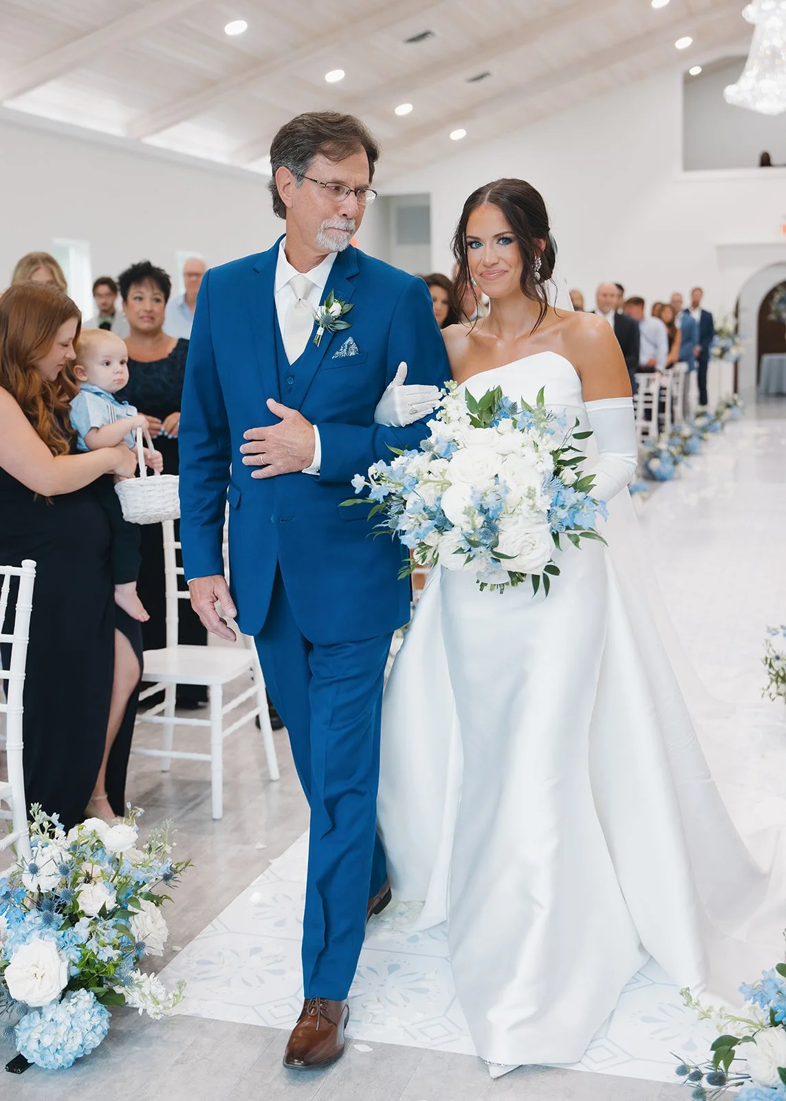 Father of the bride shares an emotional glance with his daughter.