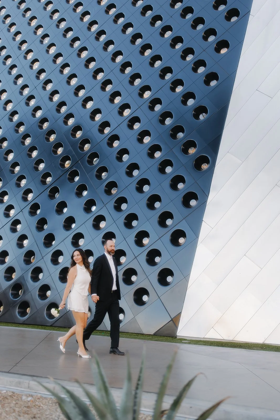 Structured engagement portrait with refined posing.