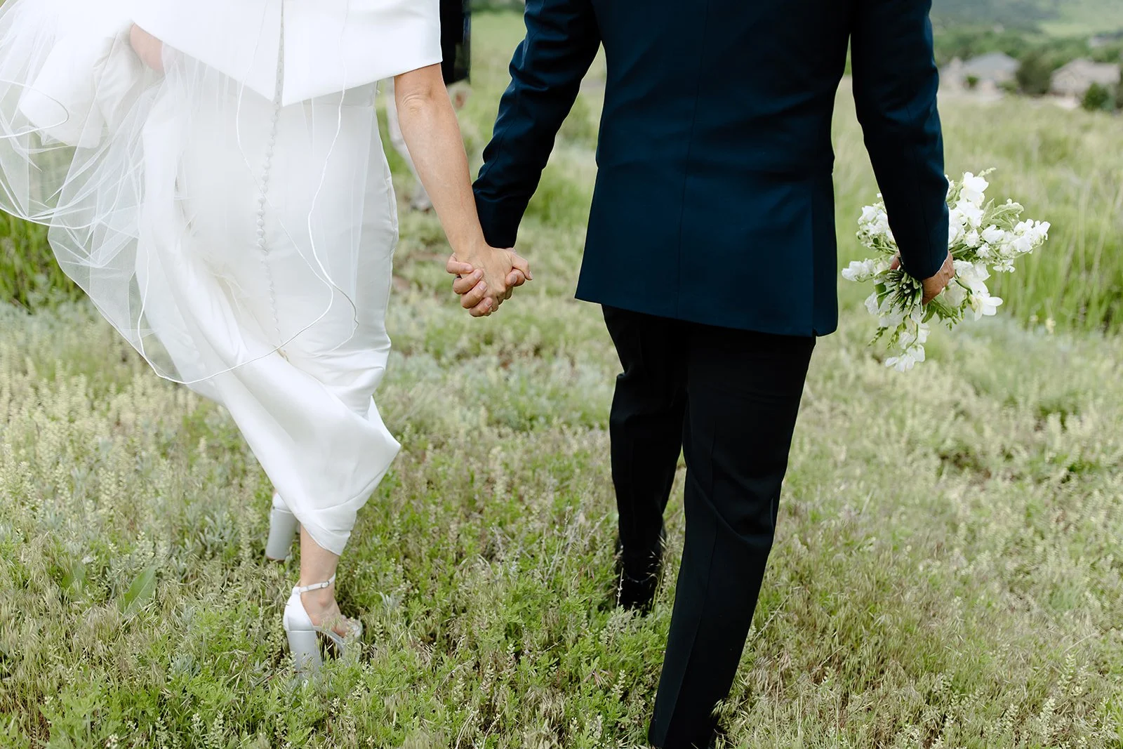 Soft editorial portrait of the couple with minimal styling.