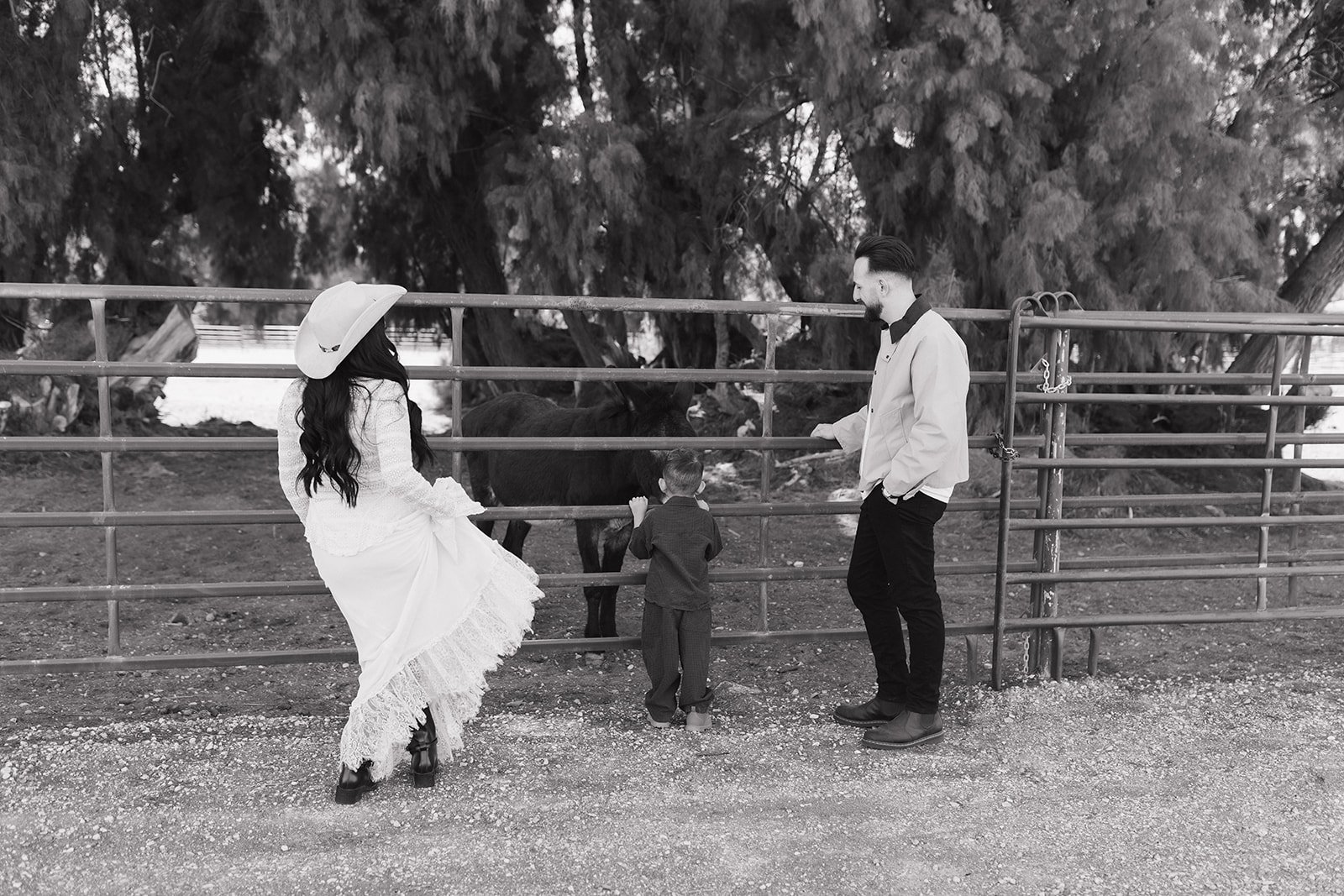 Composed maternity session in elegant outdoor environment.