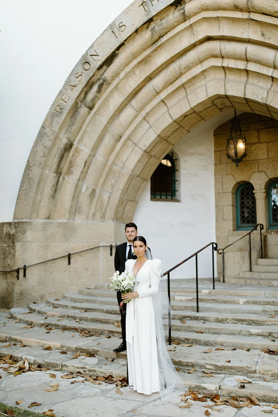 Editorial wedding couple portrait in natural light.