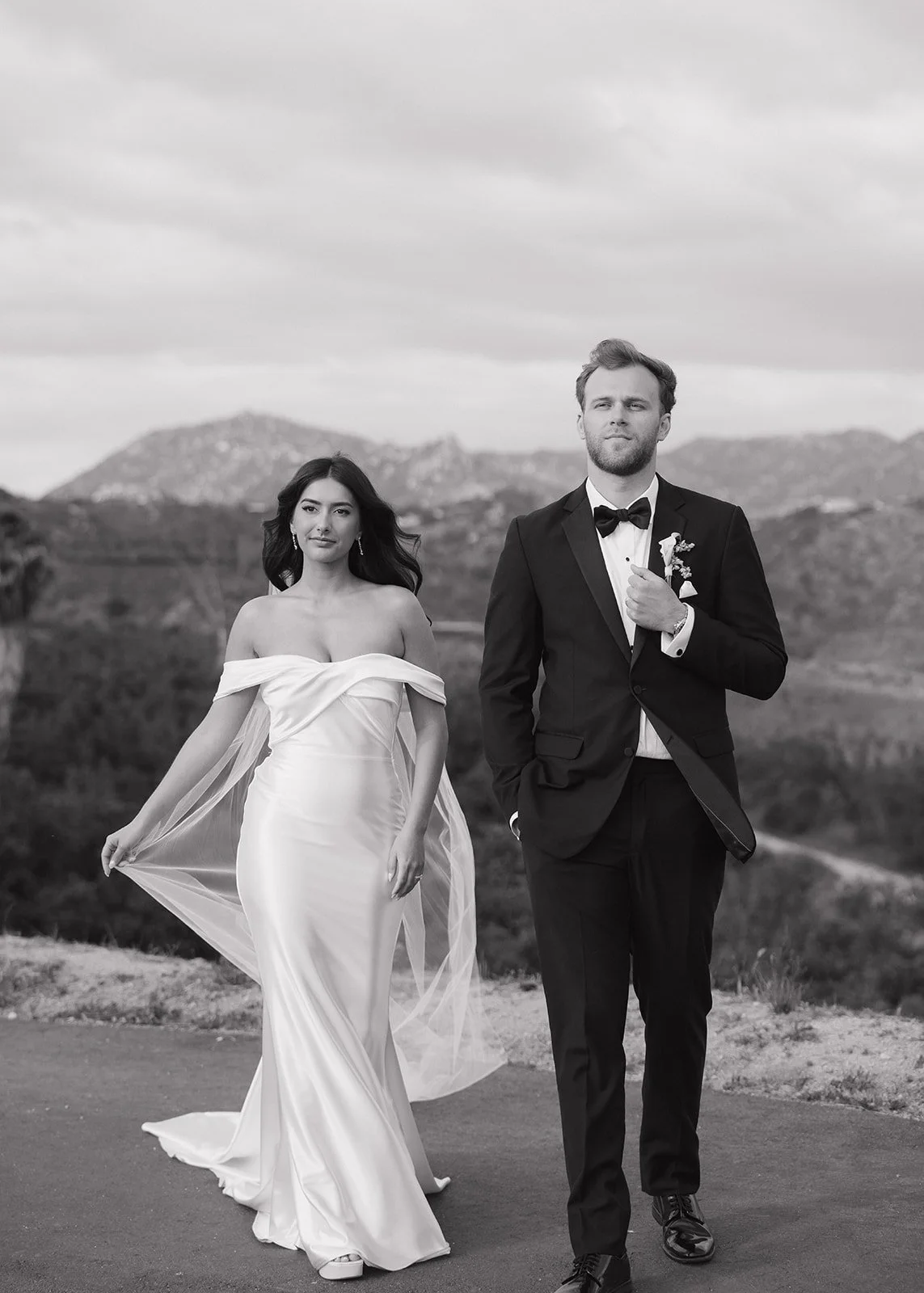 Couple portrait with veil movement.