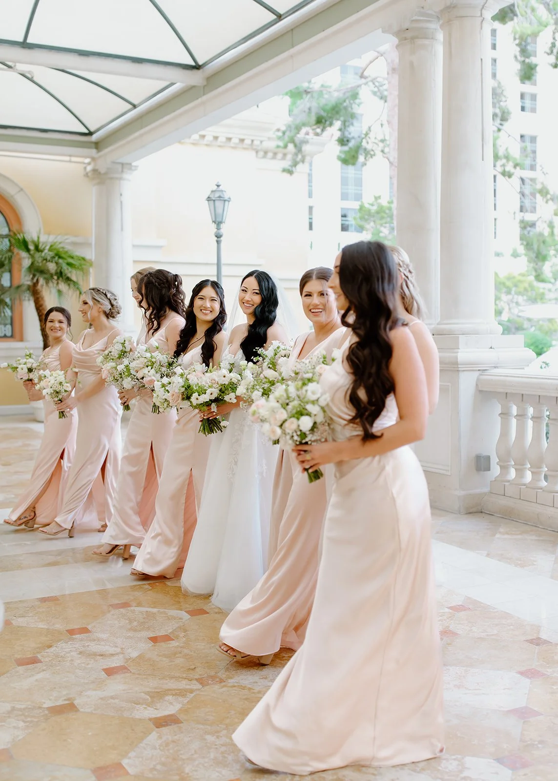 Candid bridesmaid interaction documented with a refined, editorial approach.