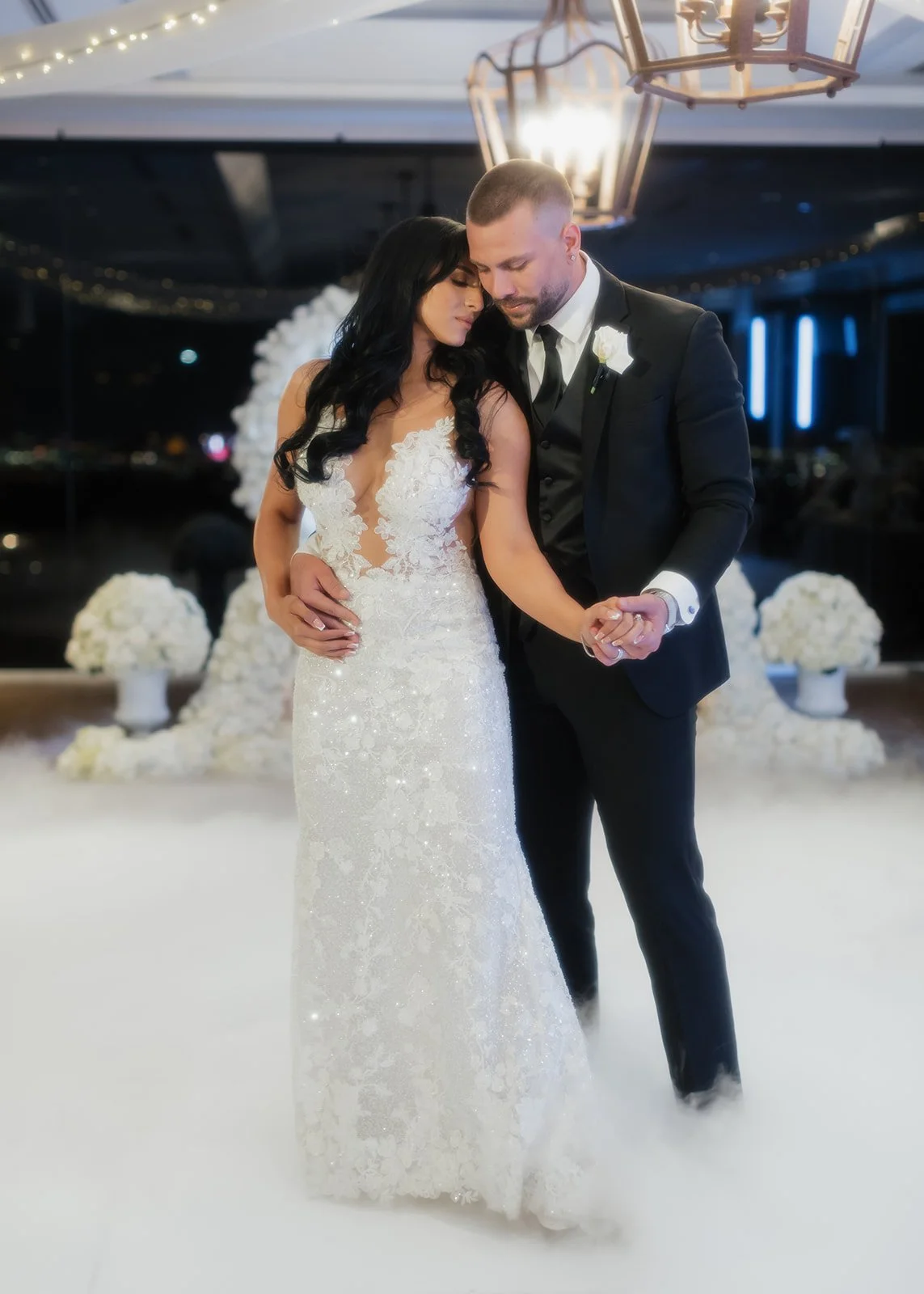 Elegant photo of bride and groom sharing choreographed first dance.