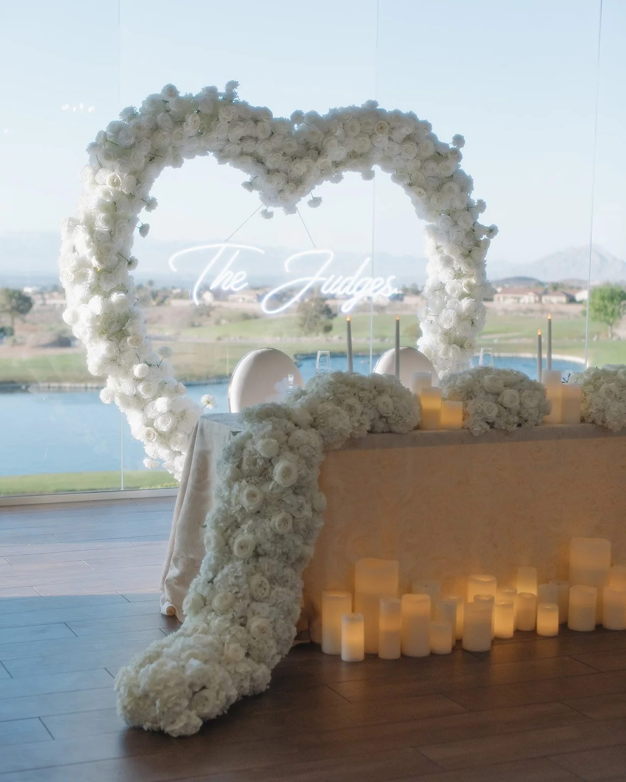 Floral heart arch at the sweetheart table.
