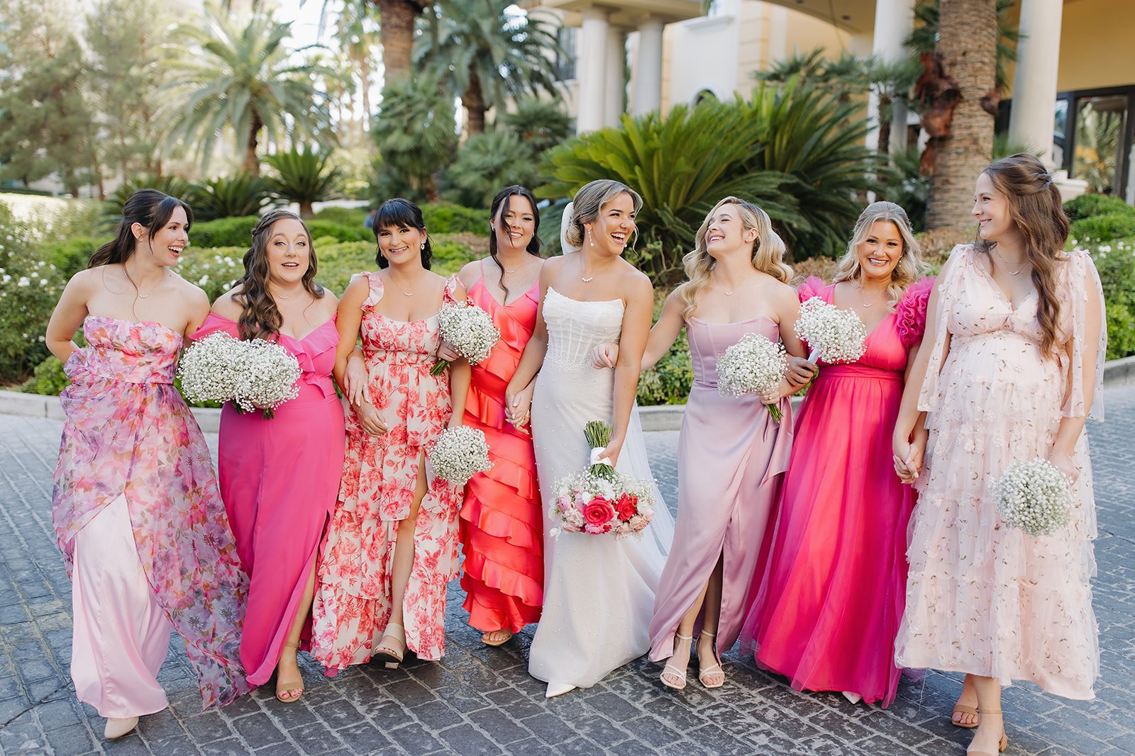Editorial bridesmaid moment with refined styling and natural laughter.