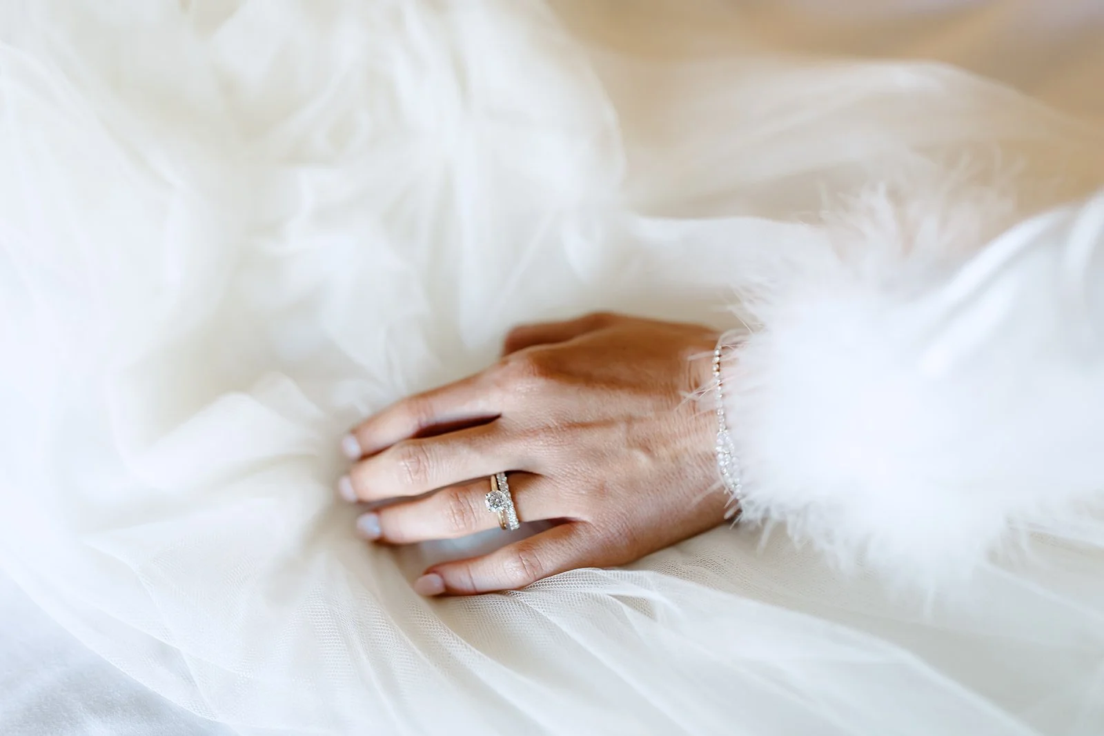 Fashion forward detail shot of the bride's ring.