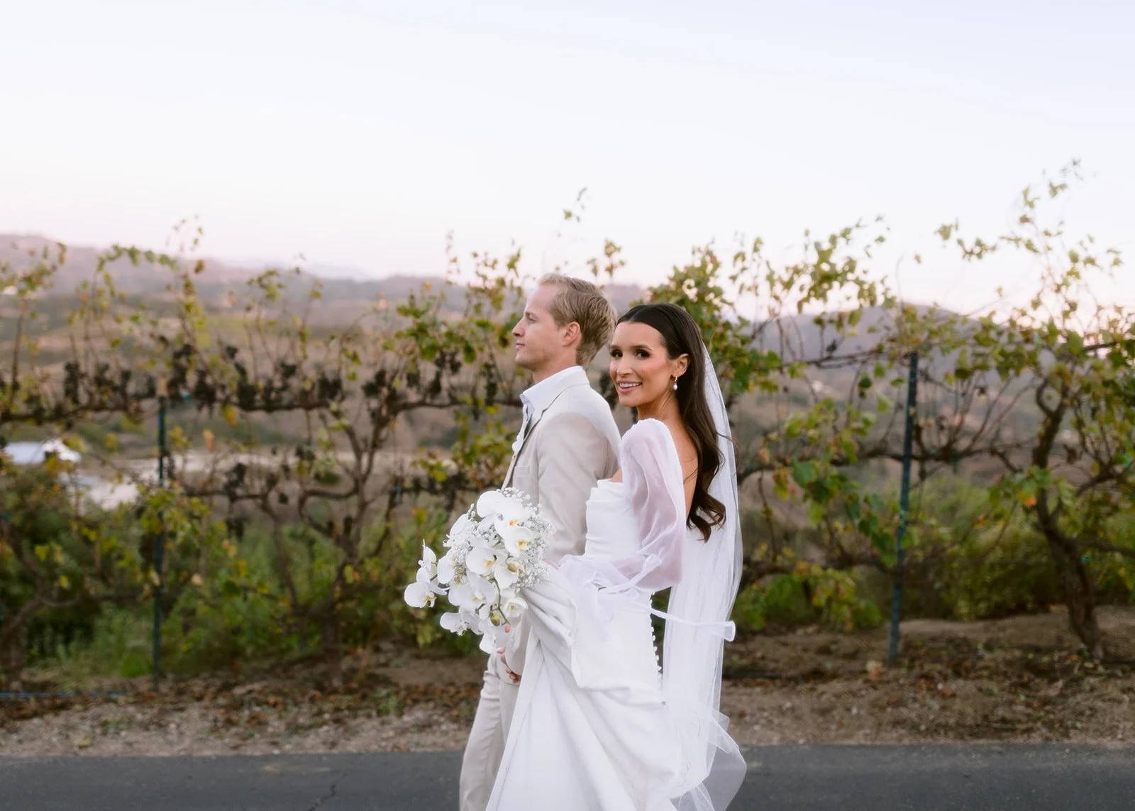 Editorial couple moment with modern styling and soft expression.