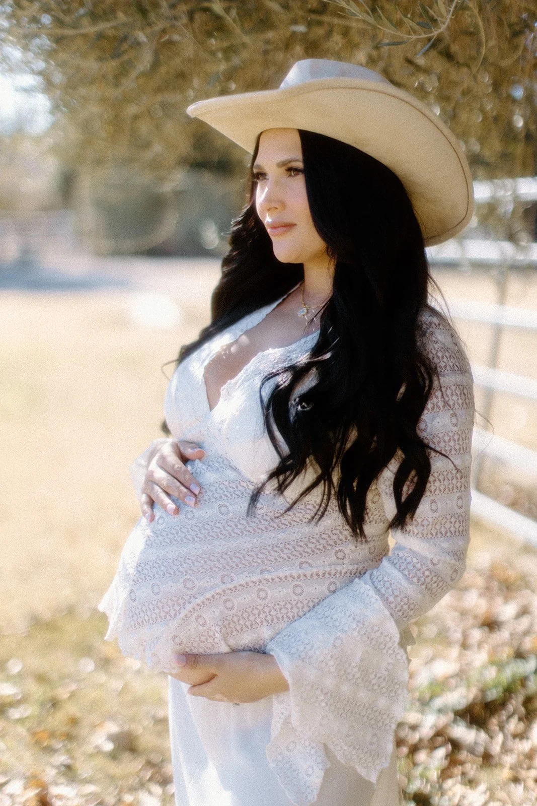 Maternity photoshoot in soft natural light.