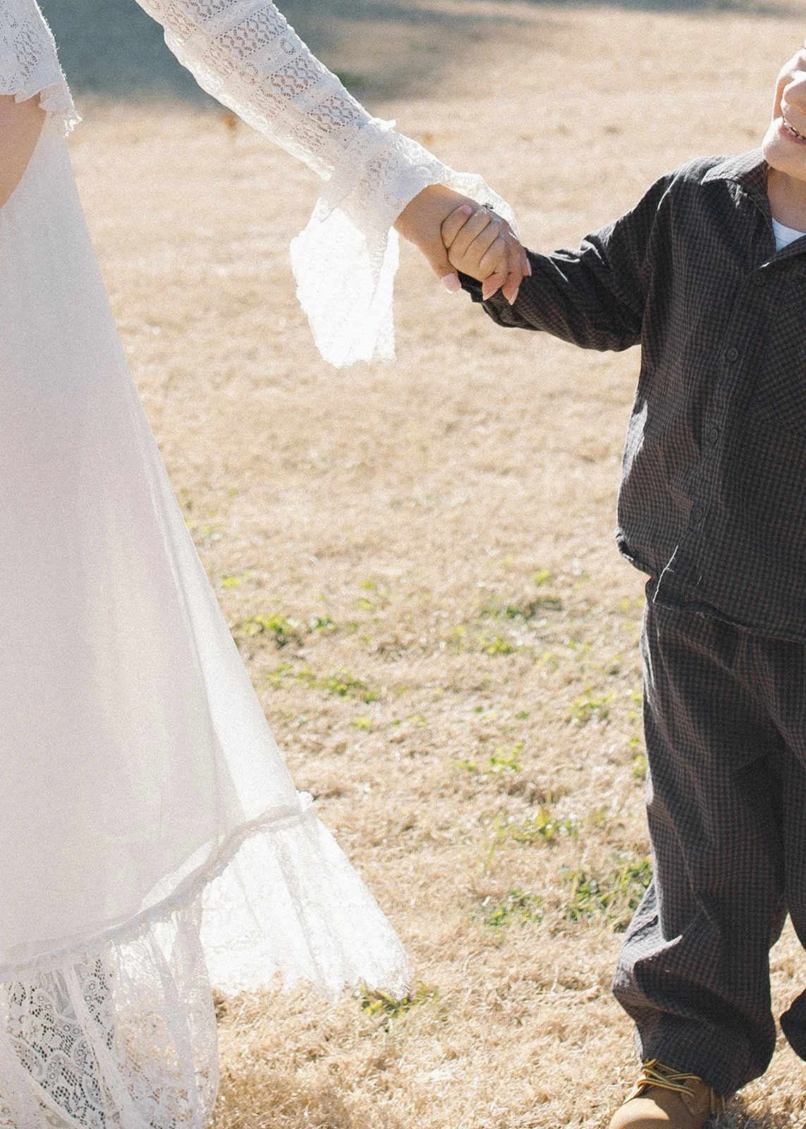 Maternity portrait captured in warm golden hour light.