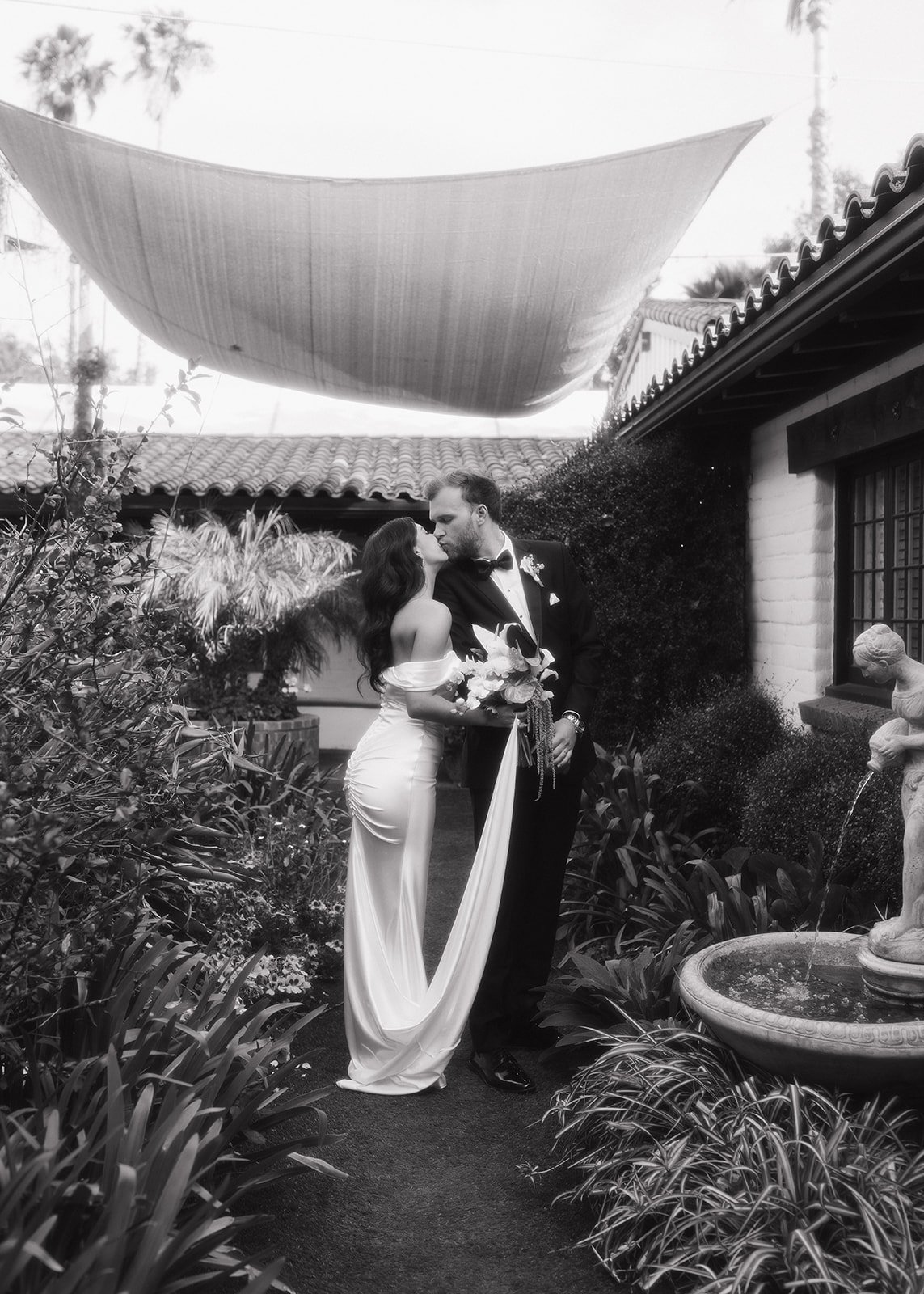 Bride and groom sharing emotional moment during wedding portrait session.