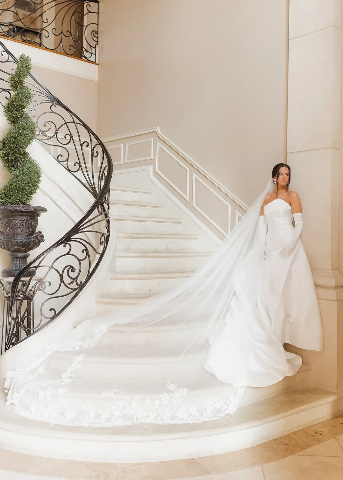 Editorial shot of bride posing on staircase.