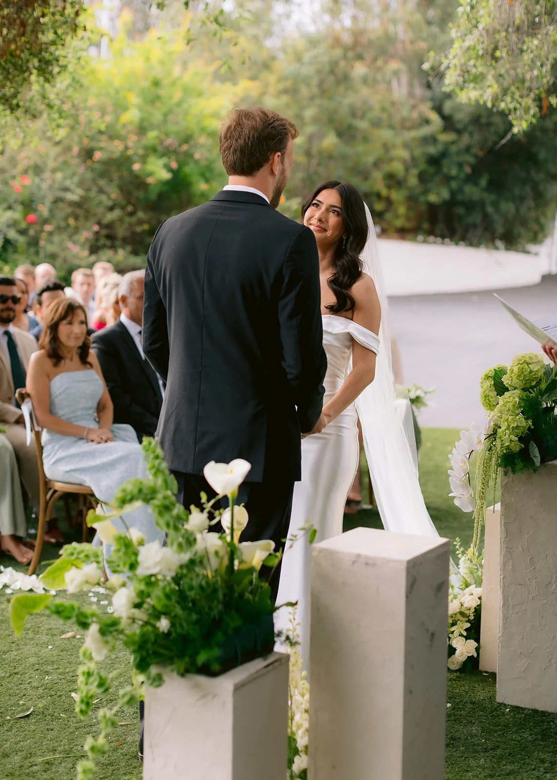 Bride stares at the groom during an emotional ceremony.