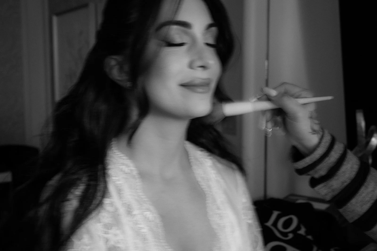 Bride getting the final makeup touches completed.