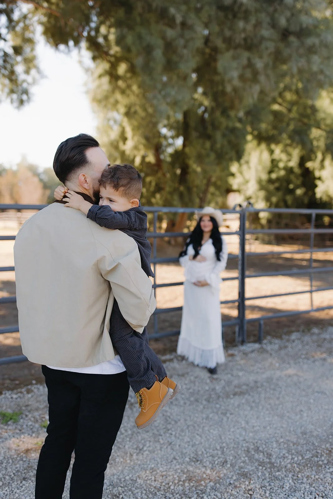 Maternity portrait captured in soft natural light outdoors.